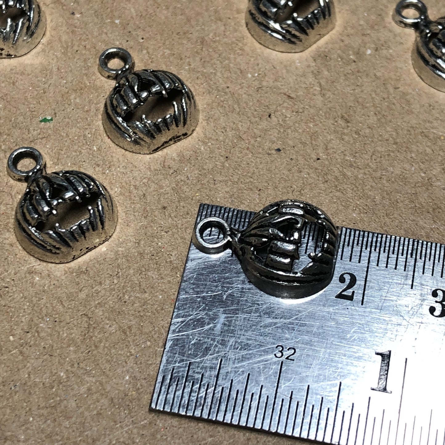 Twelve small pumpkin charms