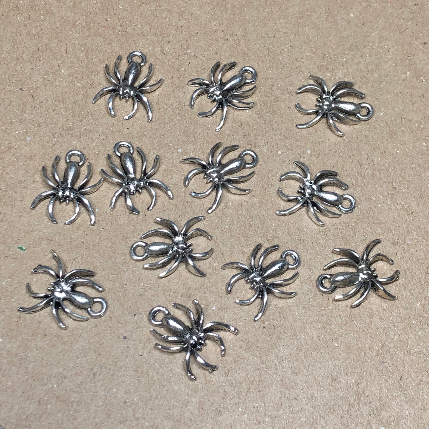 Twelve spider charms