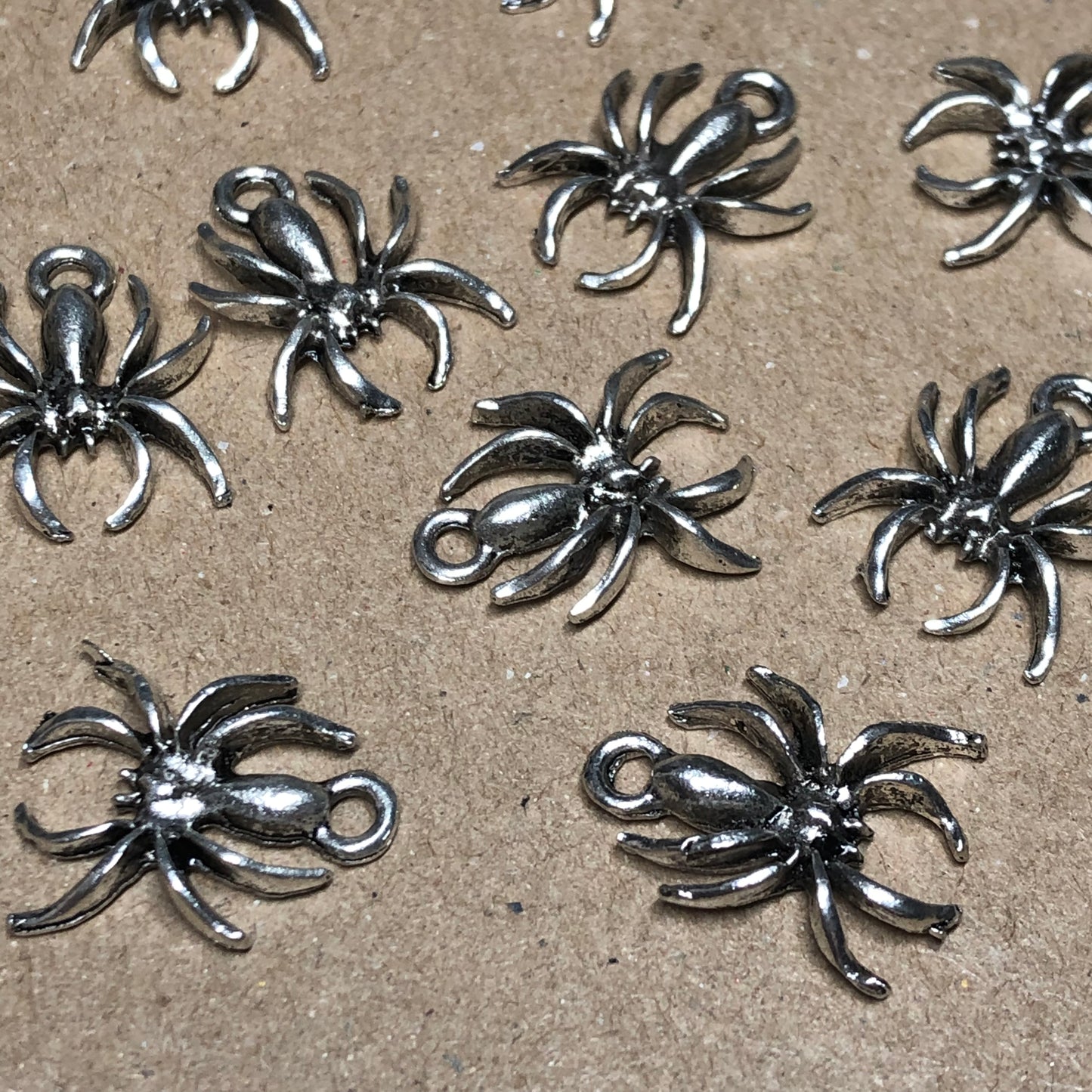 Twelve spider charms