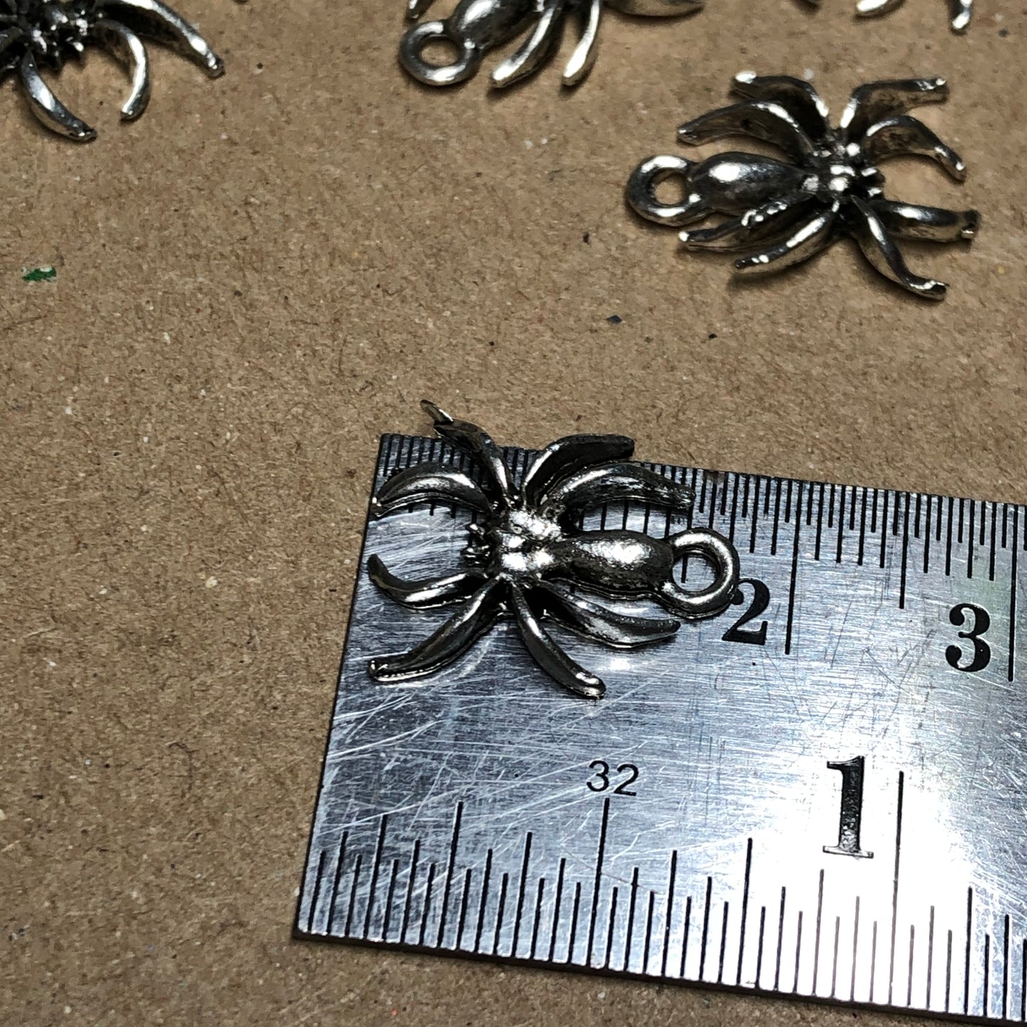 Twelve spider charms