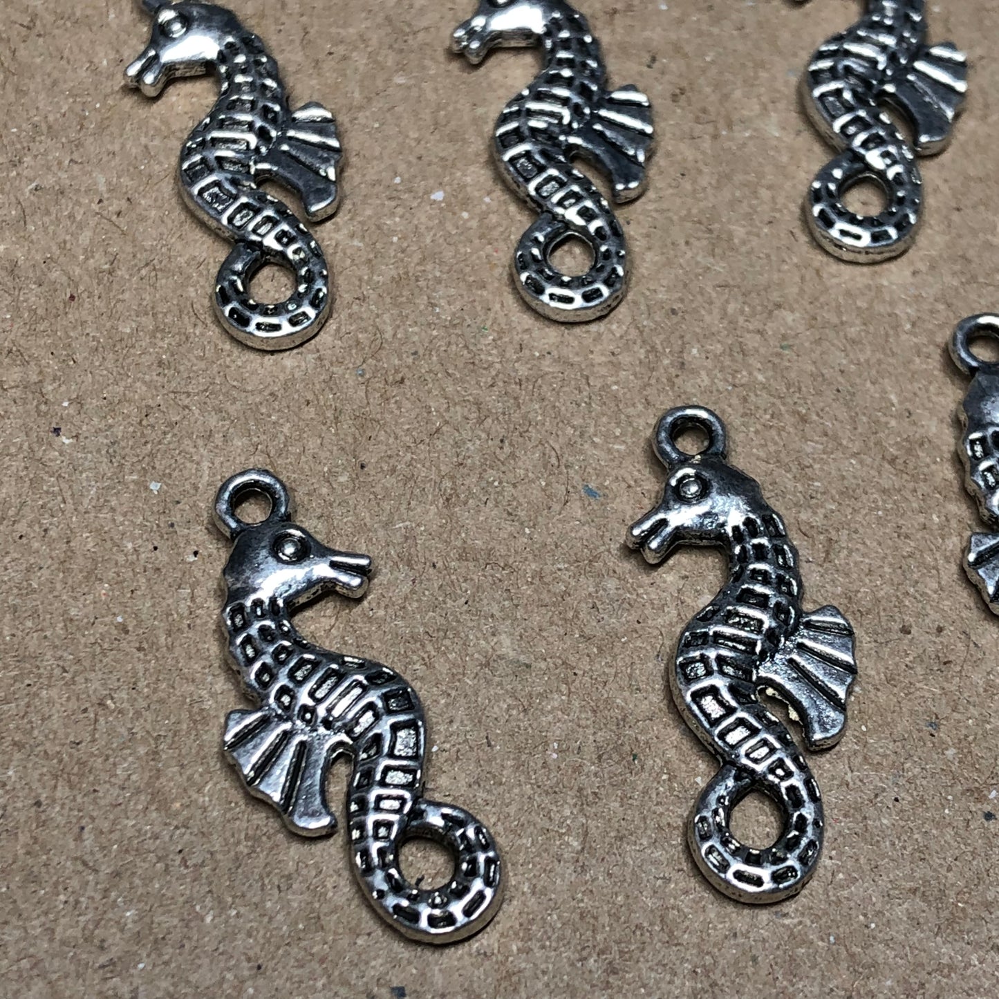 Twelve seahorse charms