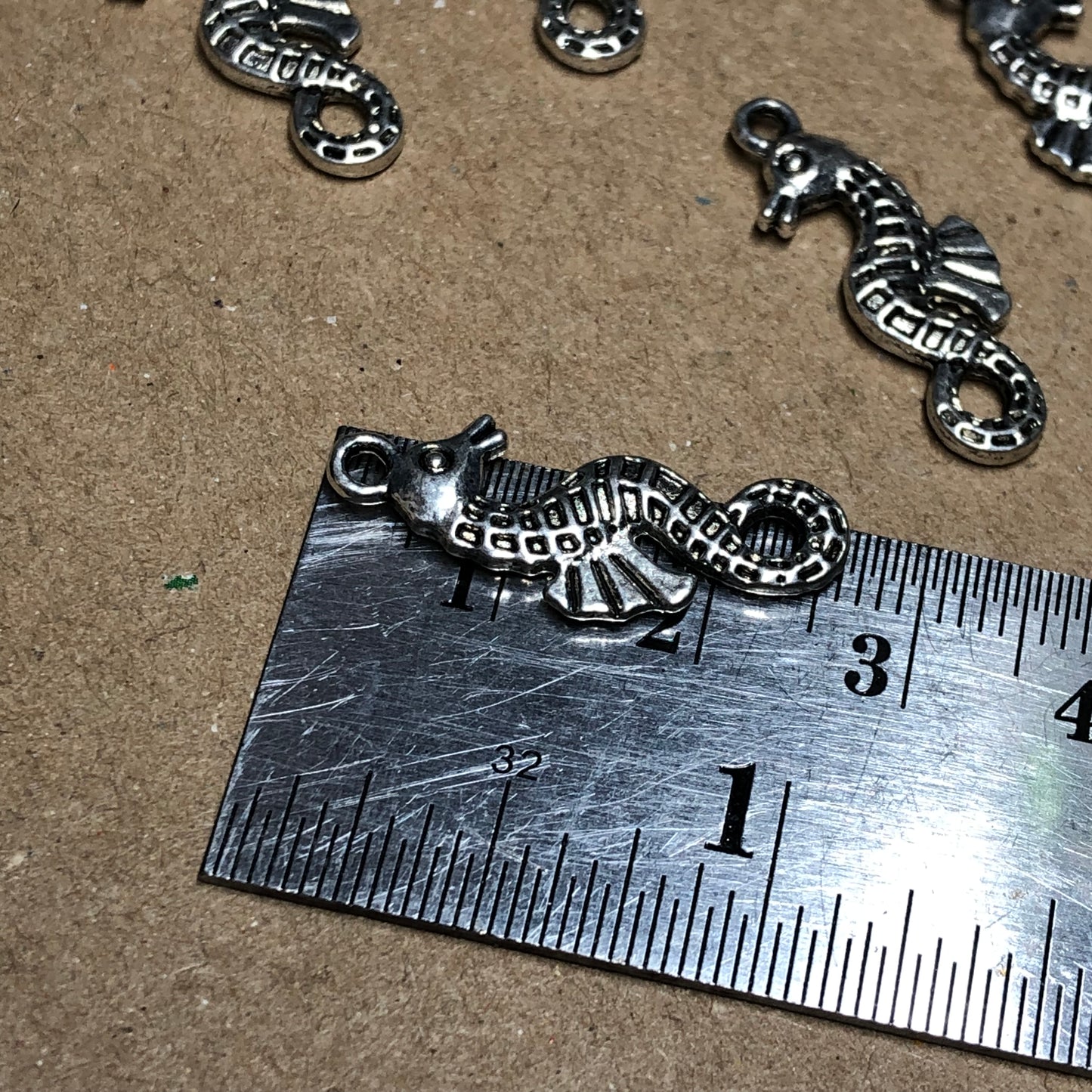 Twelve seahorse charms