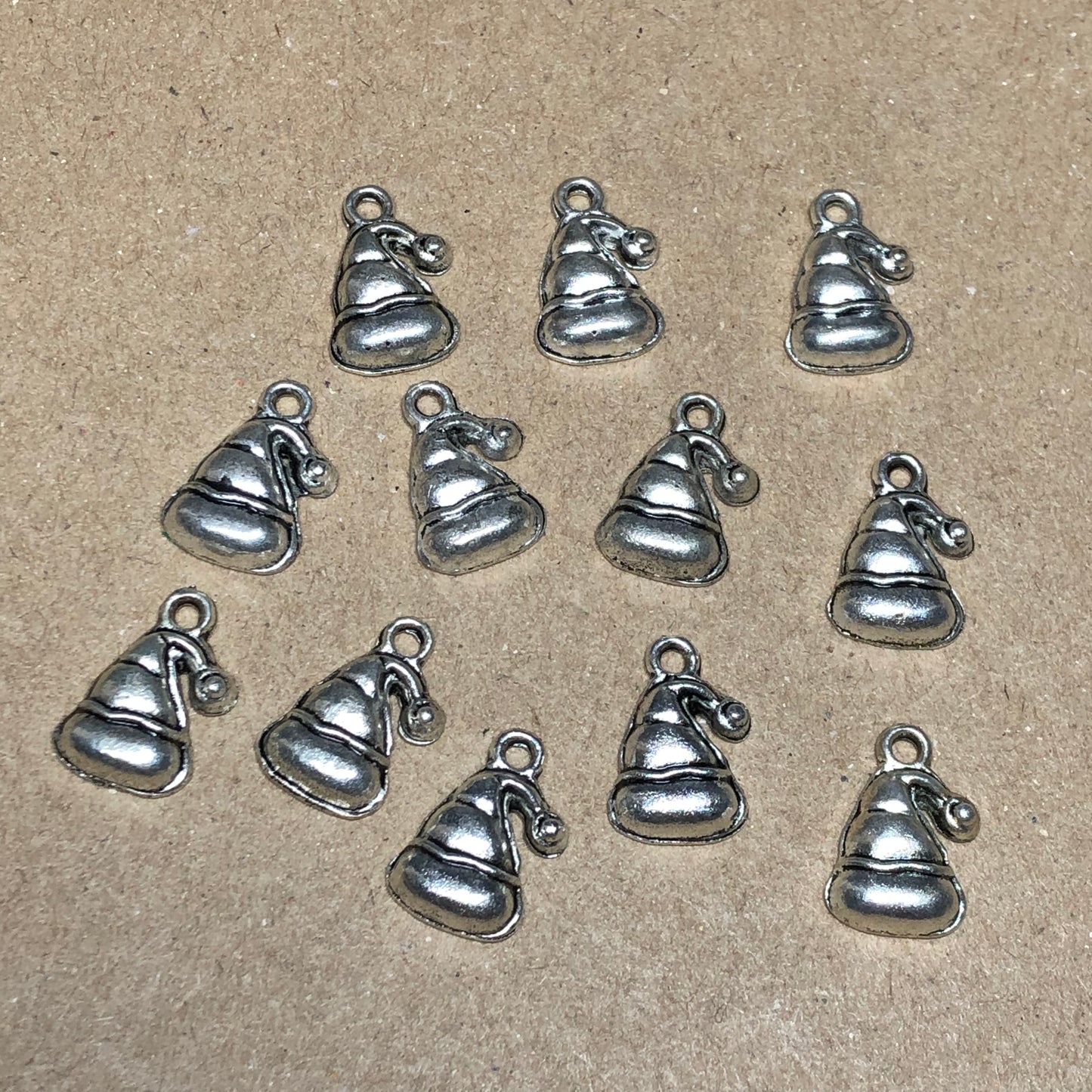 Twelve Santa hat charms