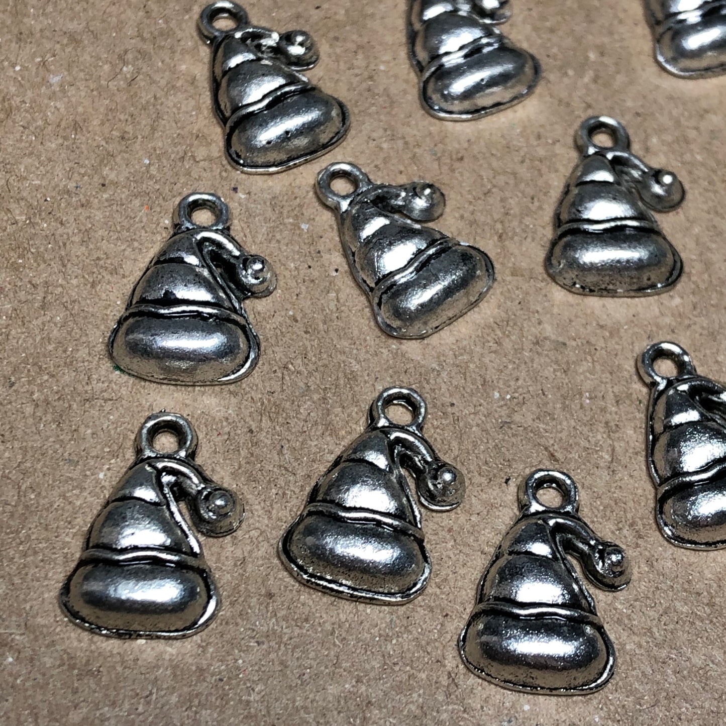 Twelve Santa hat charms