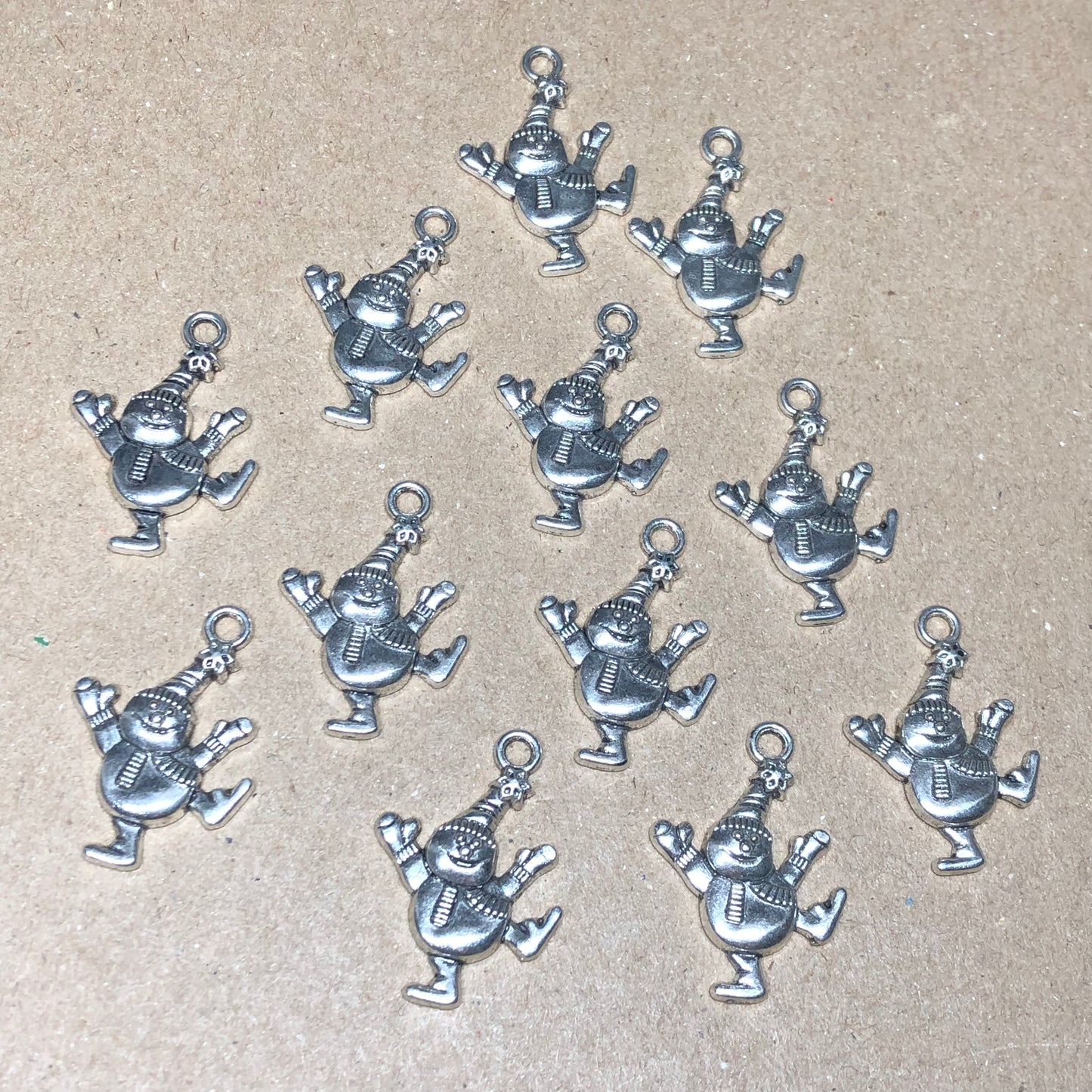 Twelve dancing snowman charms