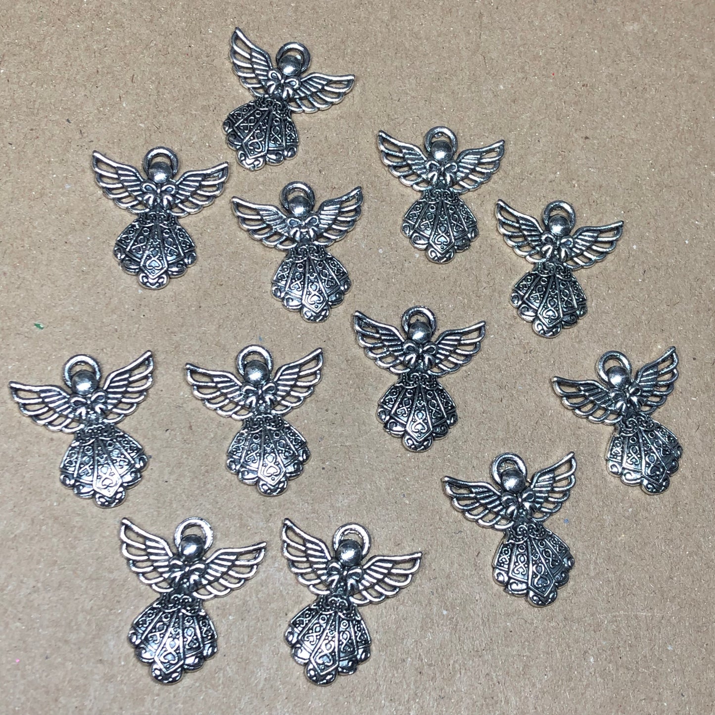 Twelve detailed angel charms