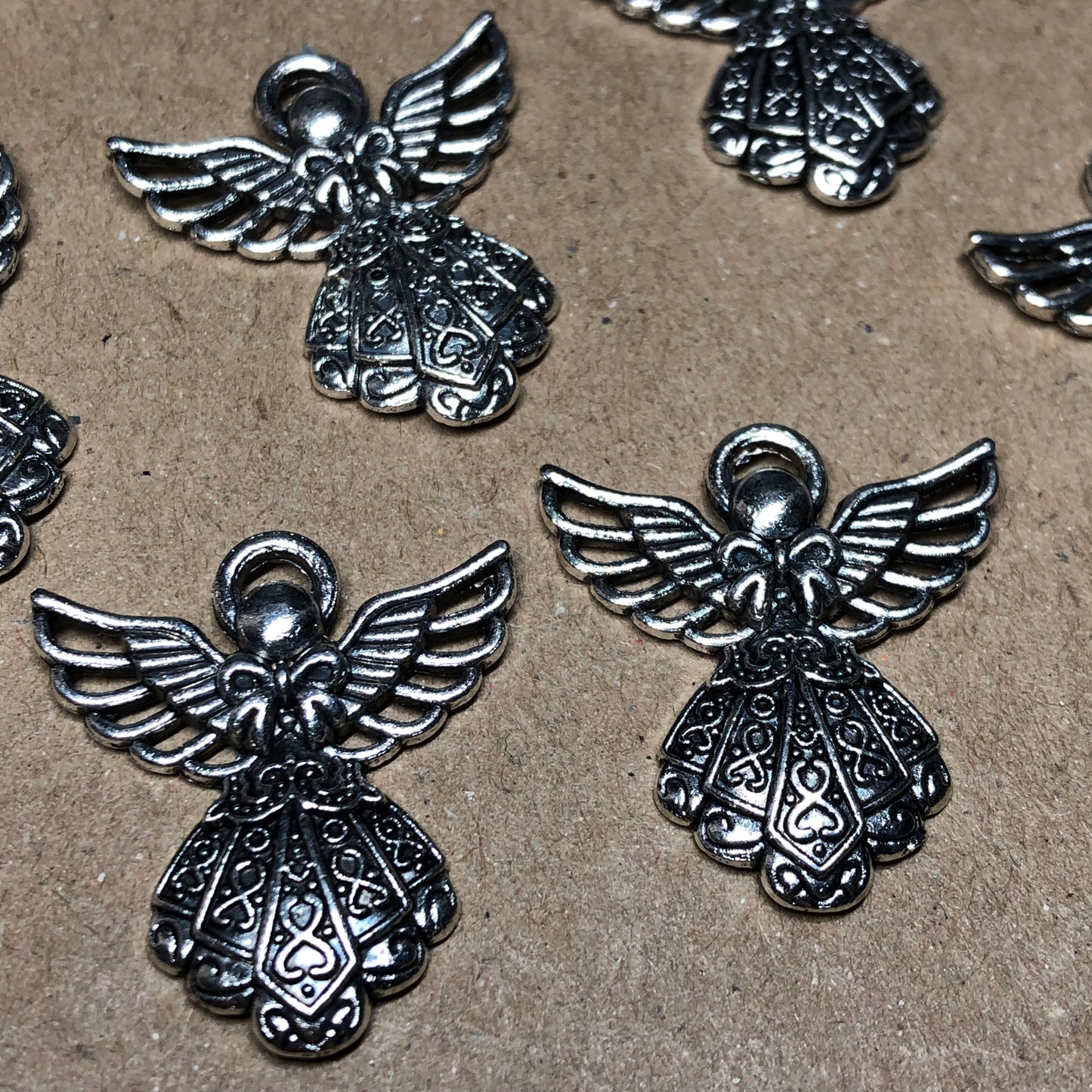 Twelve detailed angel charms