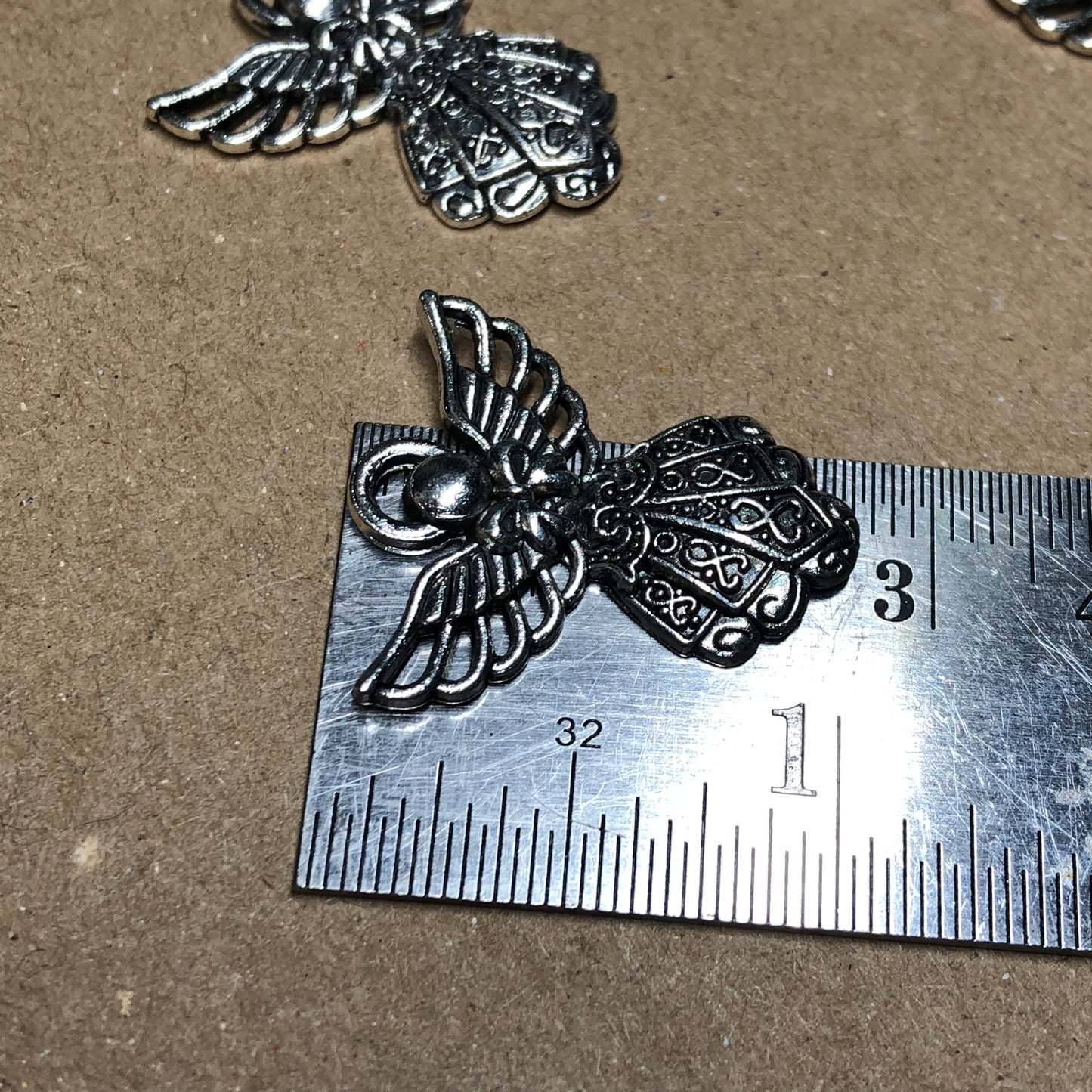 Twelve detailed angel charms