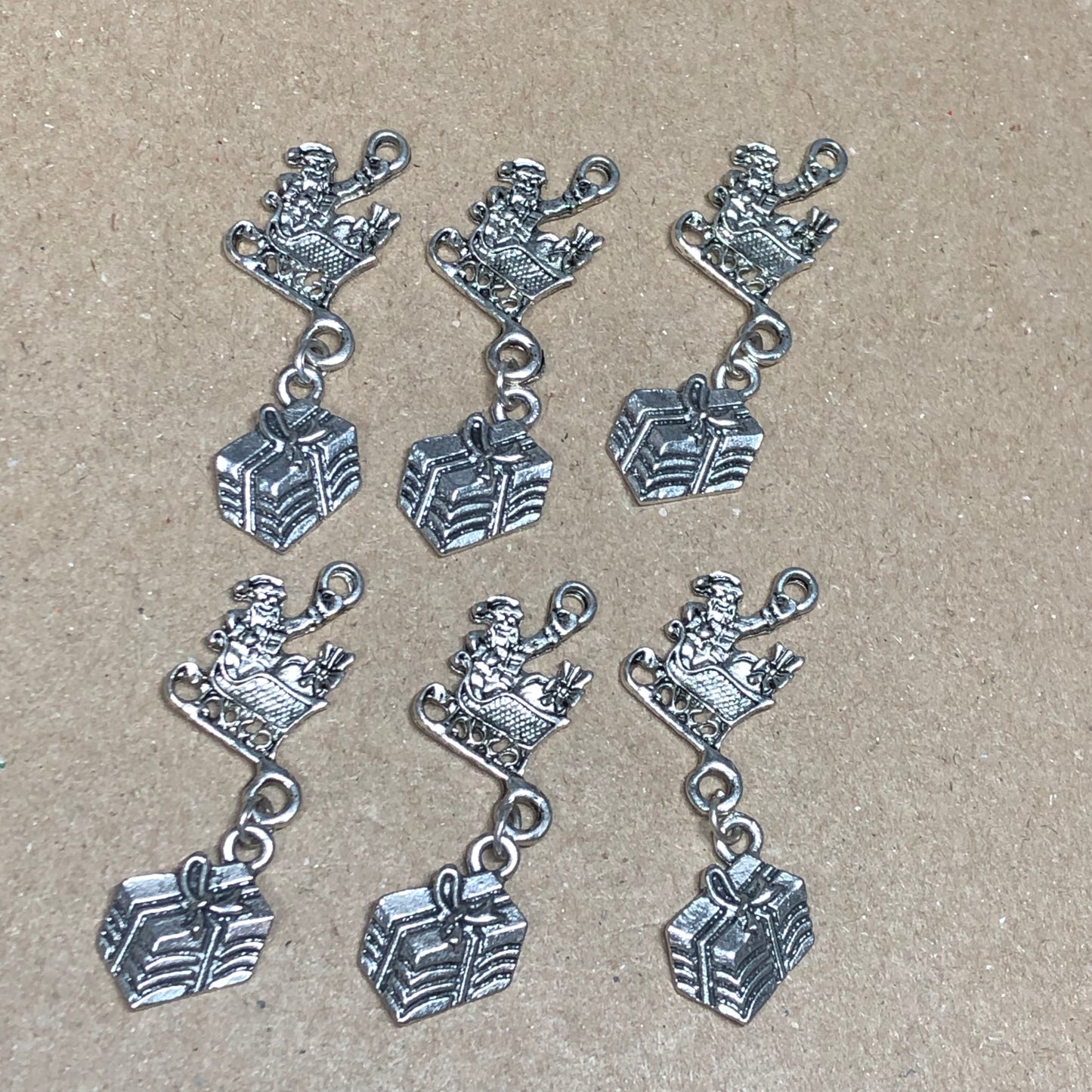 Six Santa, sleigh and gift charms