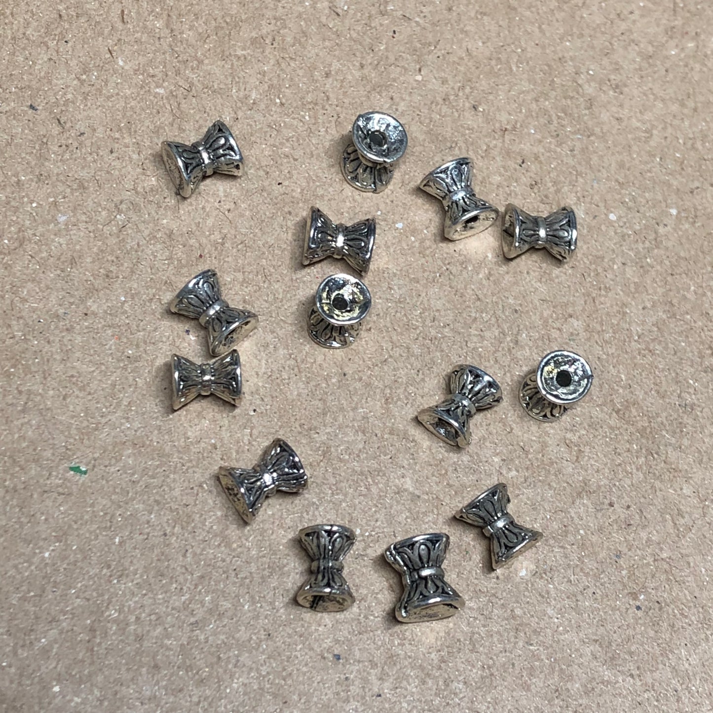 Silver hourglass spacer beads