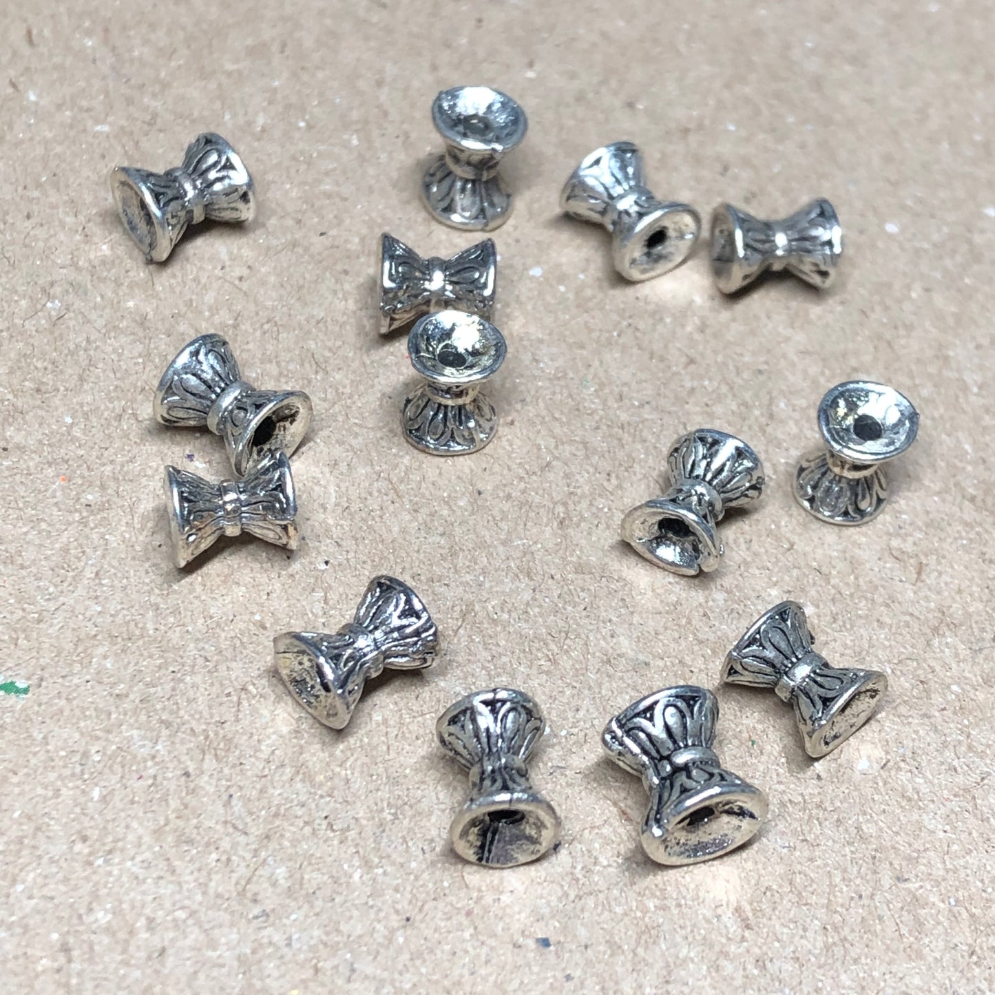 Silver hourglass spacer beads