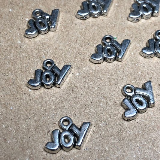 Twelve small Joy charms