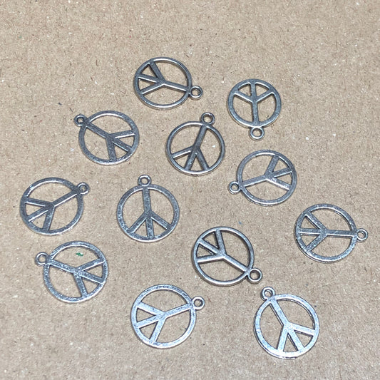 Twelve peace symbol charms