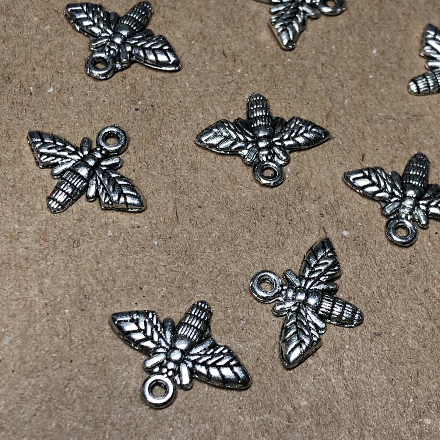 Twelve bumble bee charms