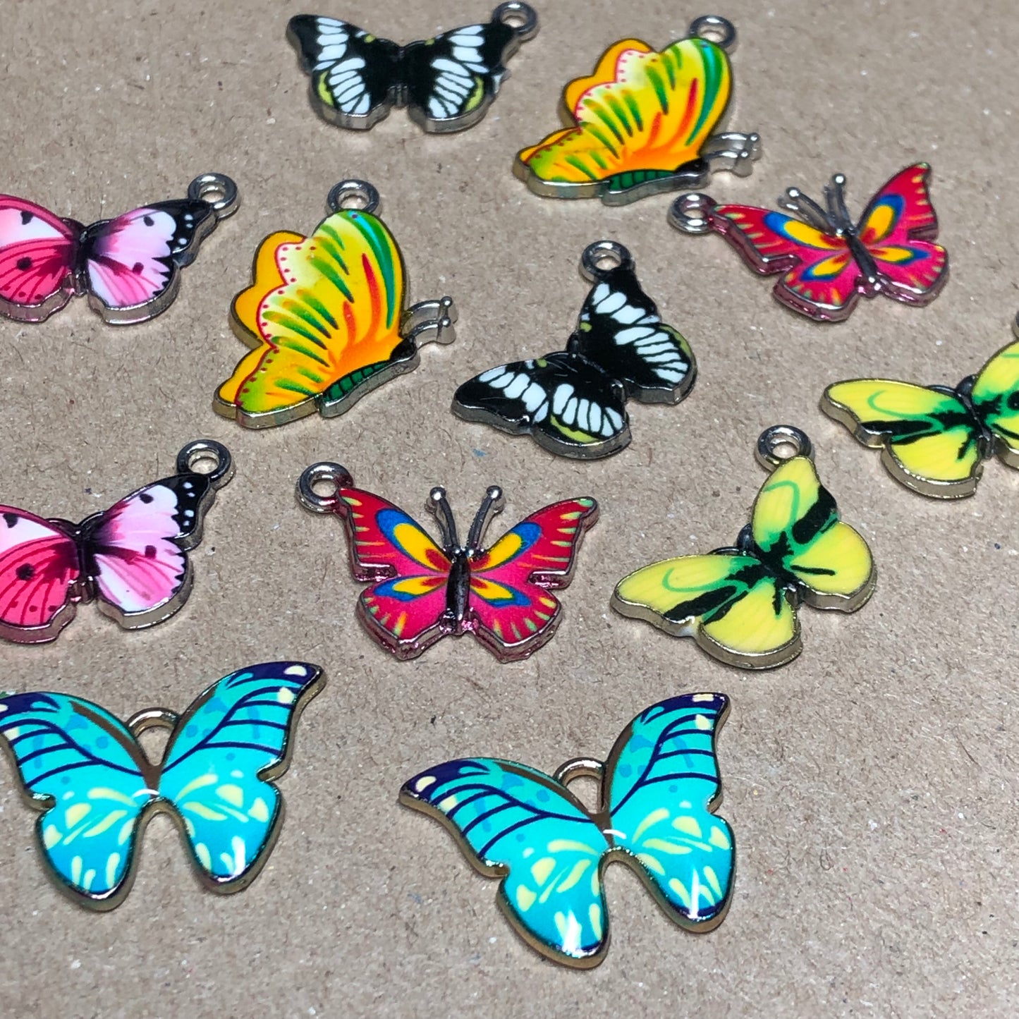 Twelve mixed colour butterfly charms