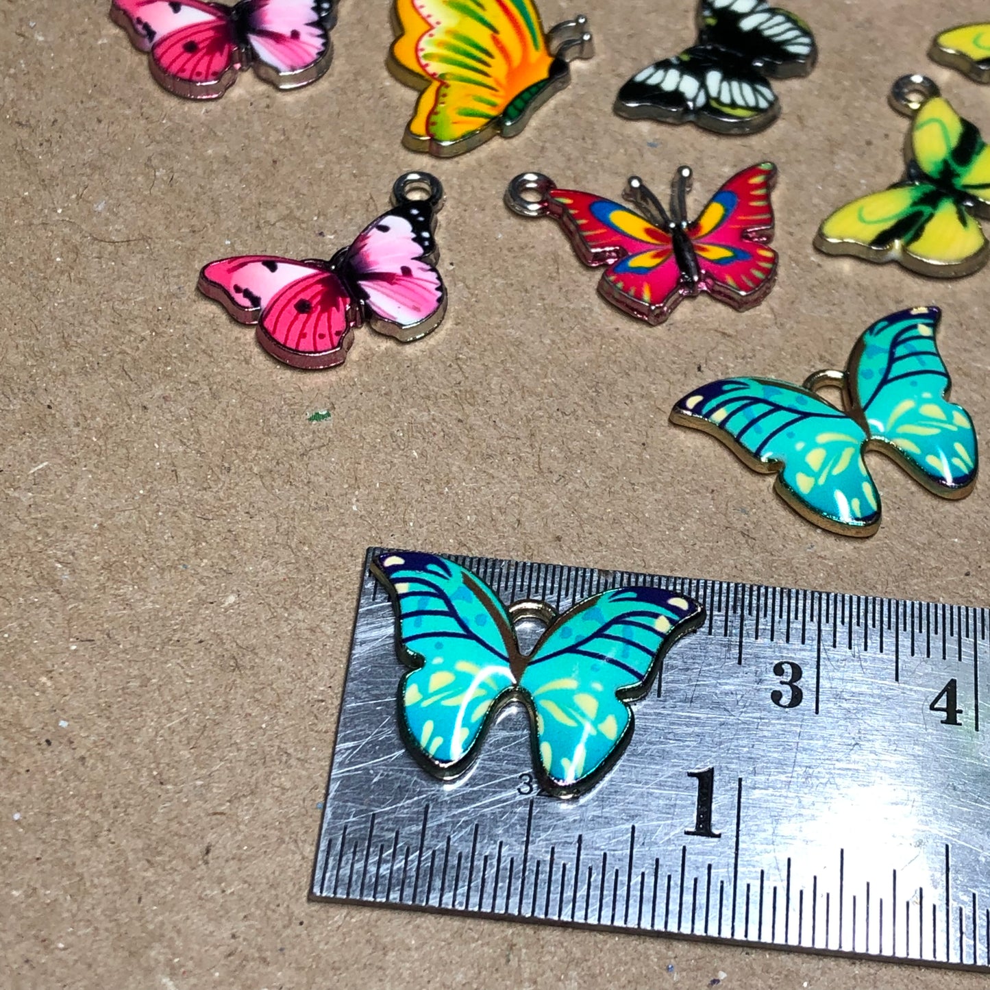 Twelve mixed colour butterfly charms