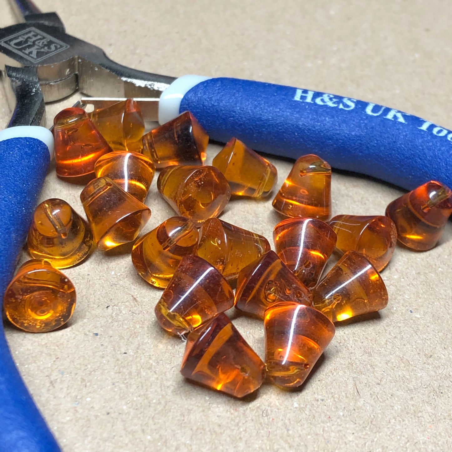 Amber glass cowbell beads