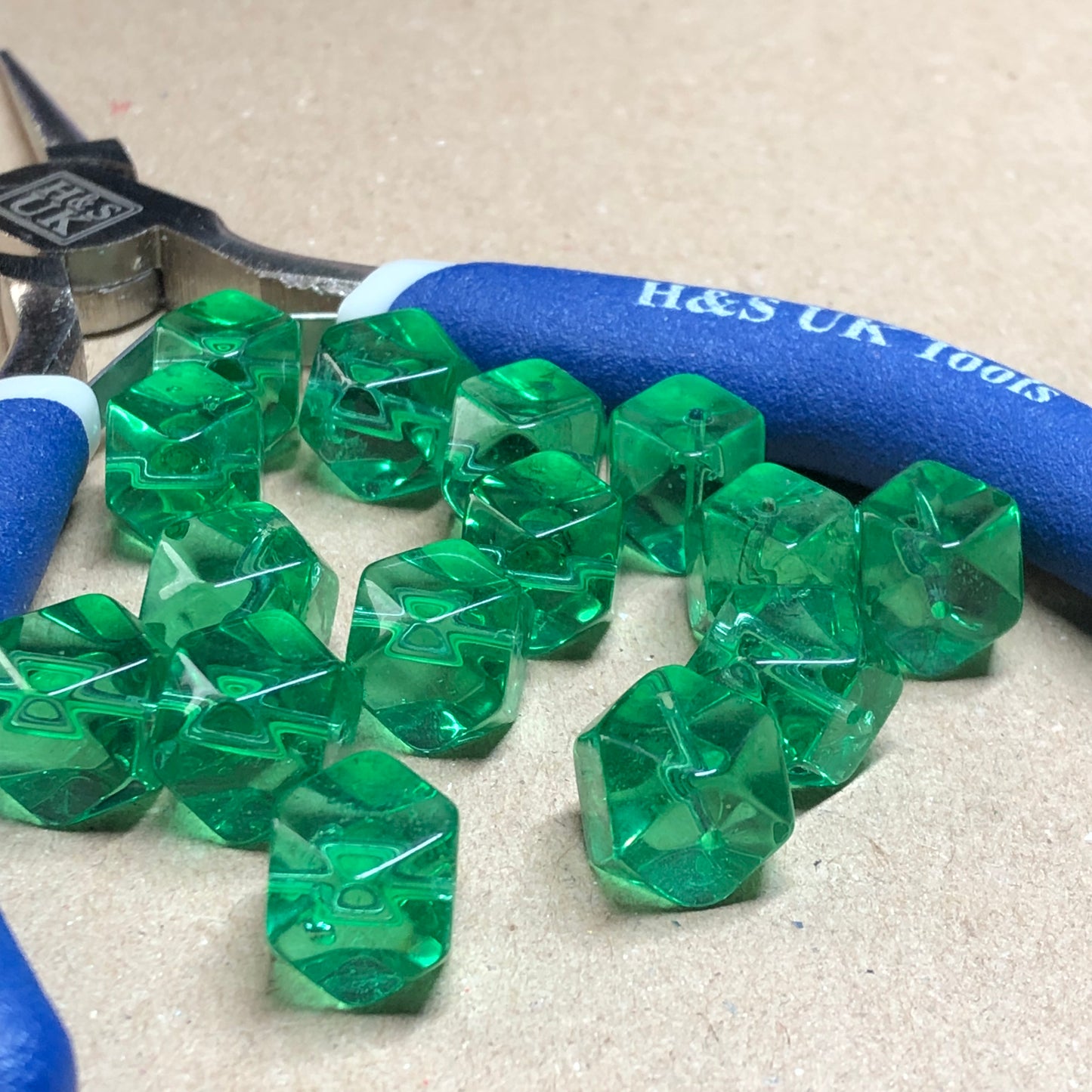 Green faceted cube shaped glass beads