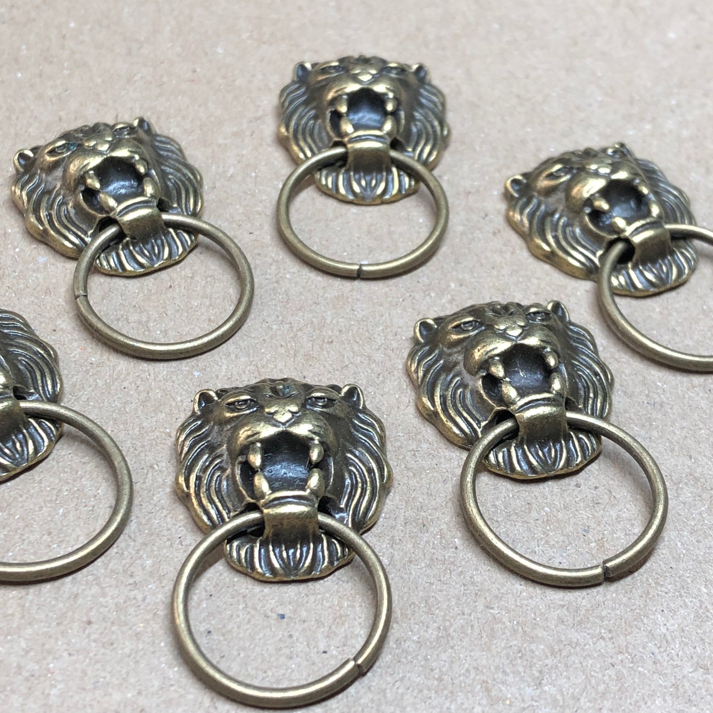 Six bronze doorknocker charms