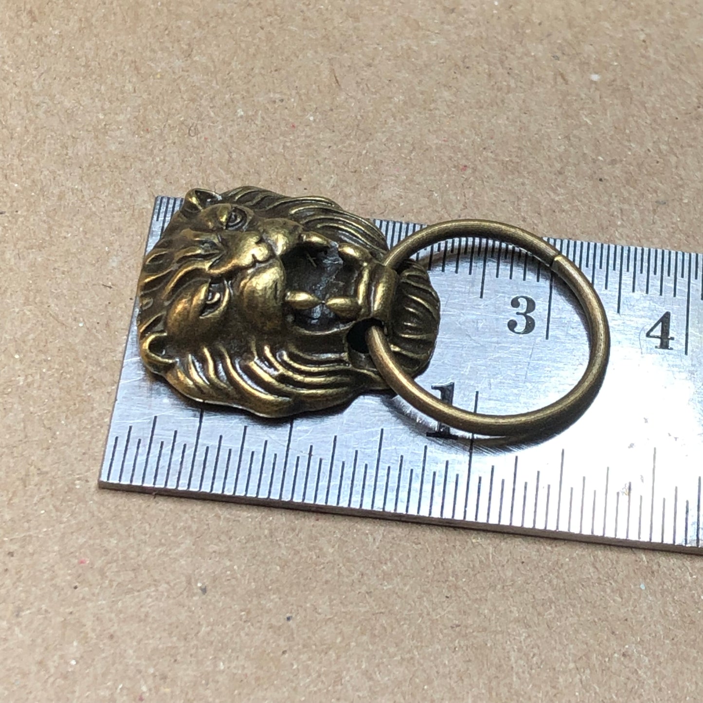 Six bronze doorknocker charms