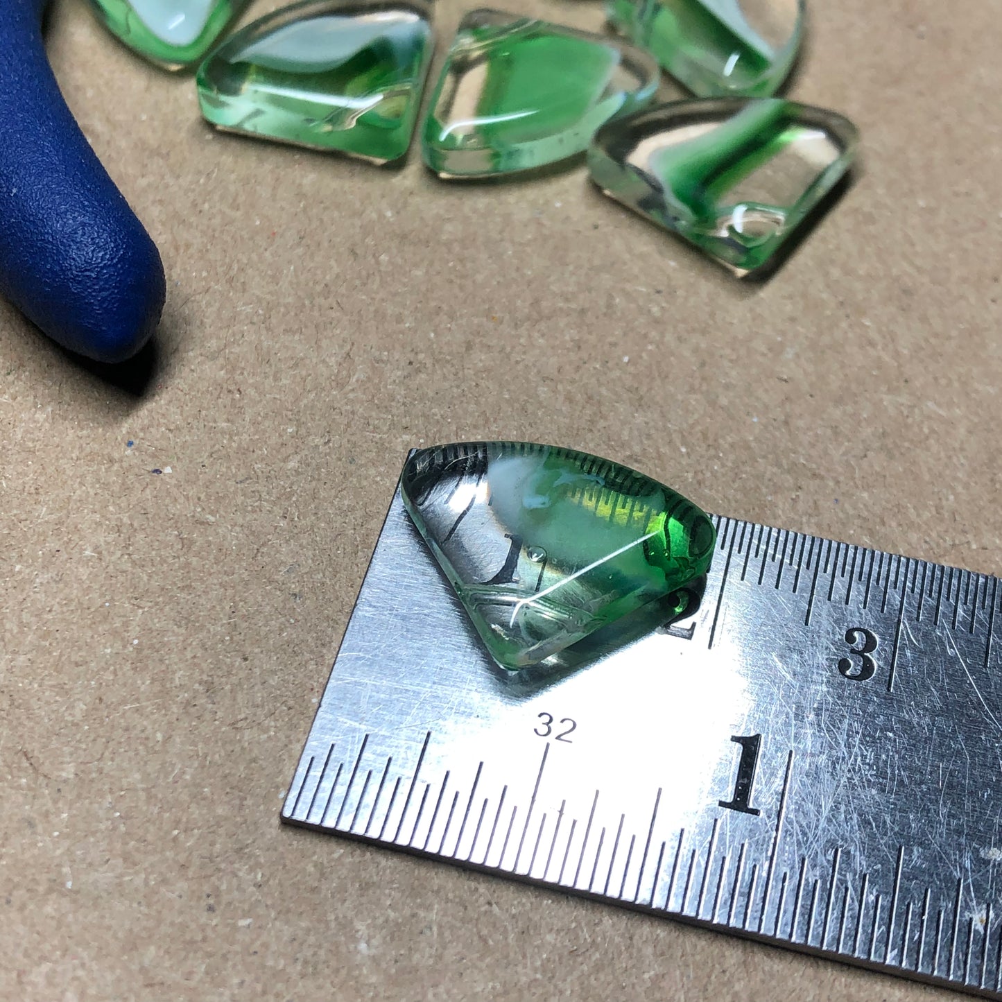 Green fan shaped glass beads