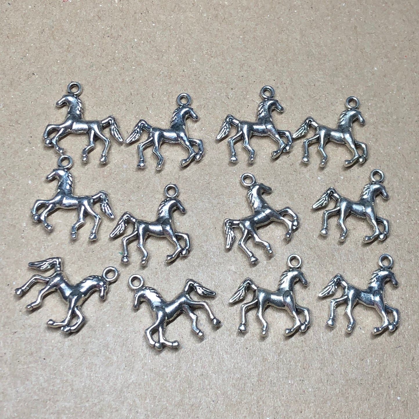 Twelve pony horse charms