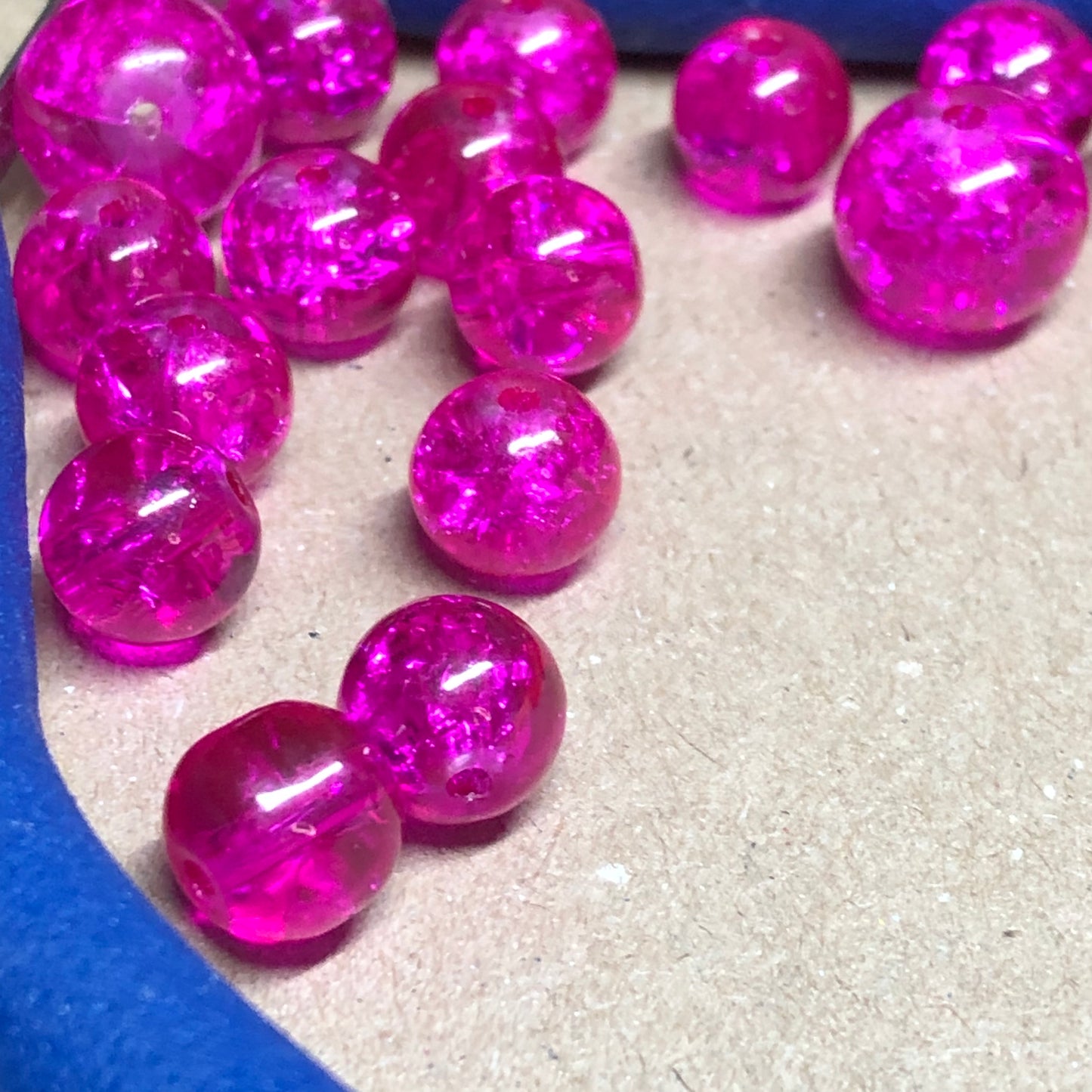 Mixed size bright pink crackle glass beads