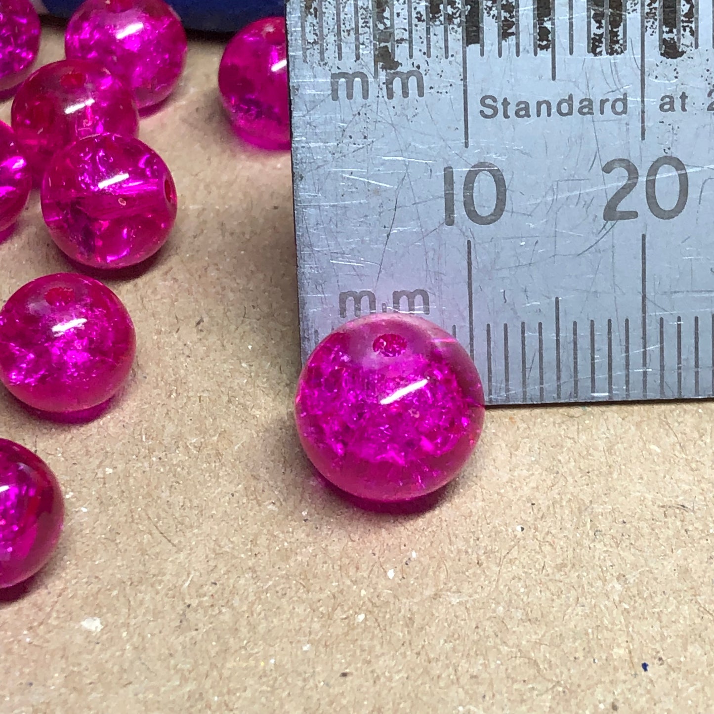 Mixed size bright pink crackle glass beads