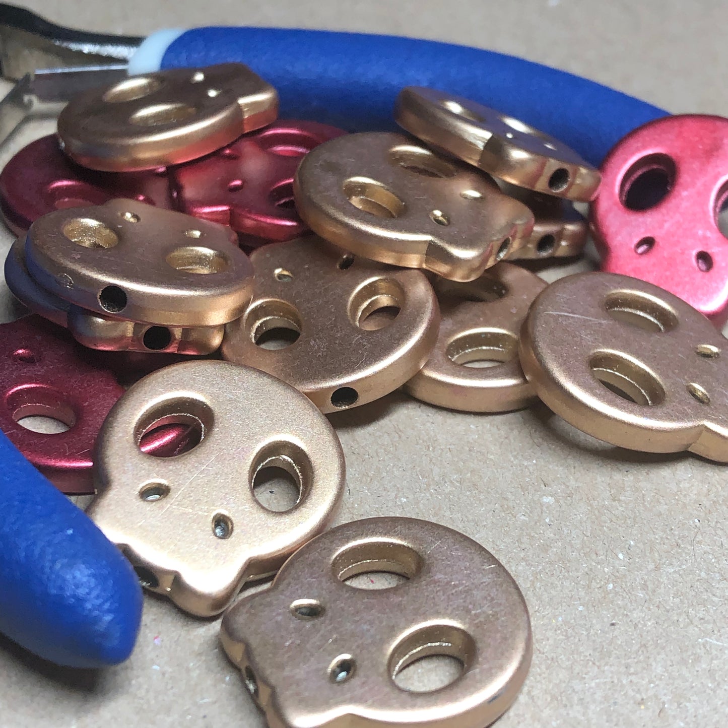 Red and gold acrylic skull beads