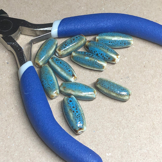 Blue bugle shaped clay beads