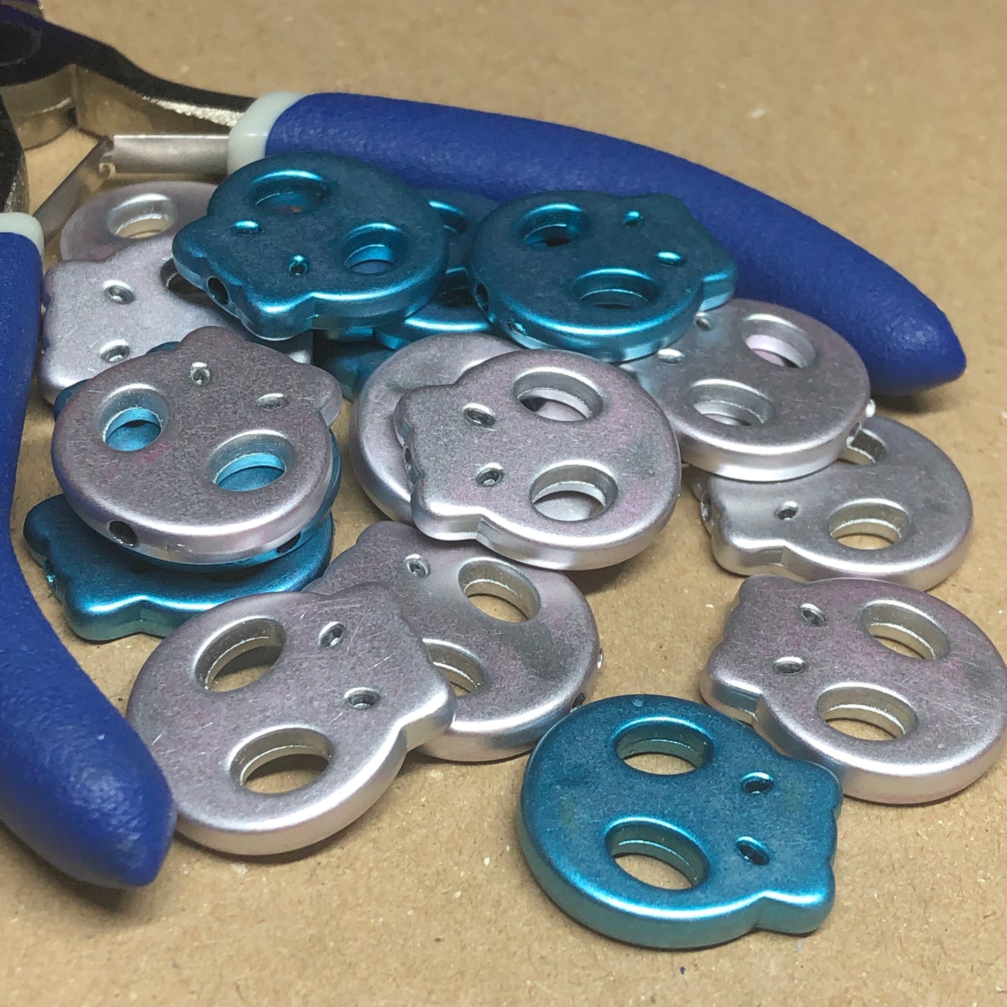 Blue and silver acrylic skull beads