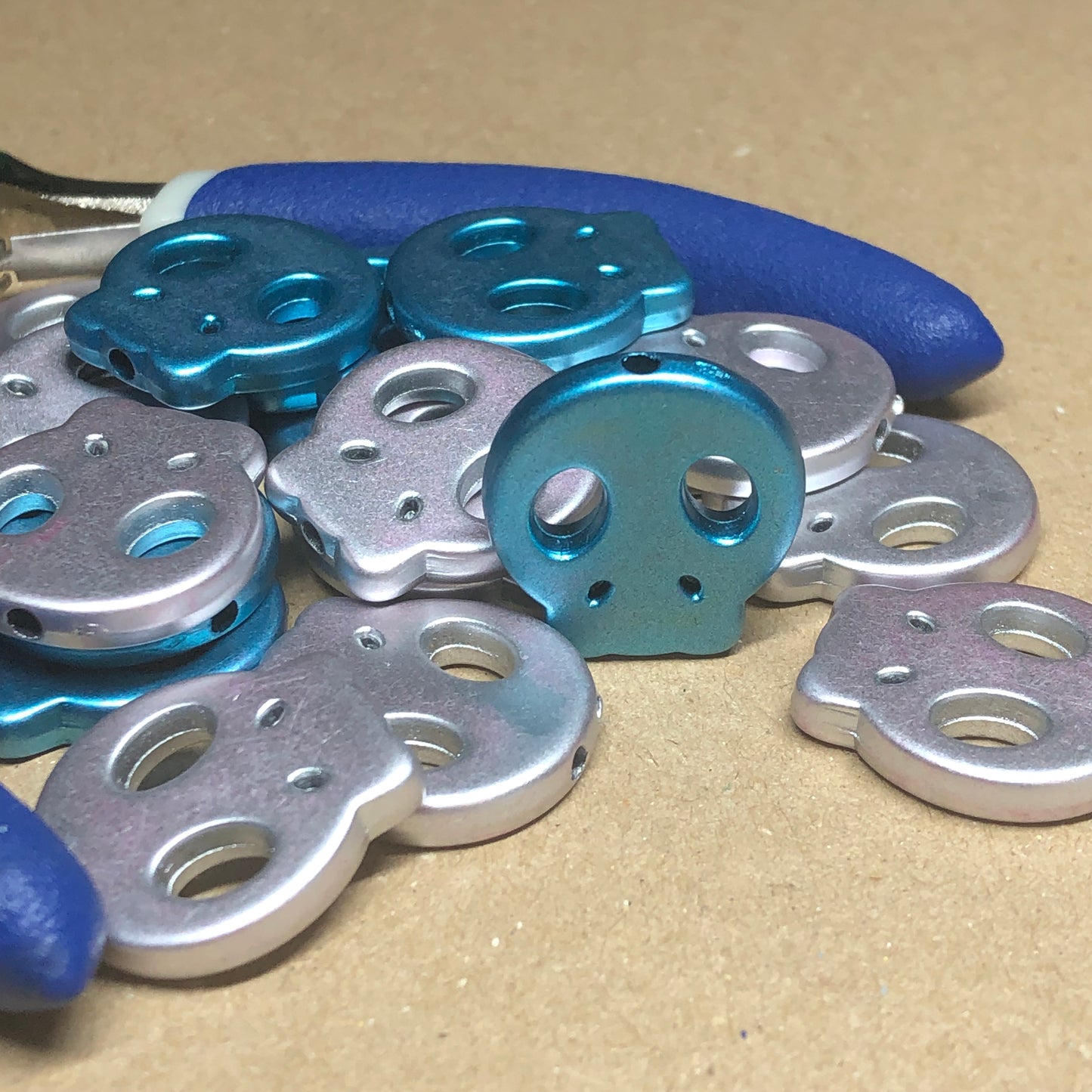 Blue and silver acrylic skull beads