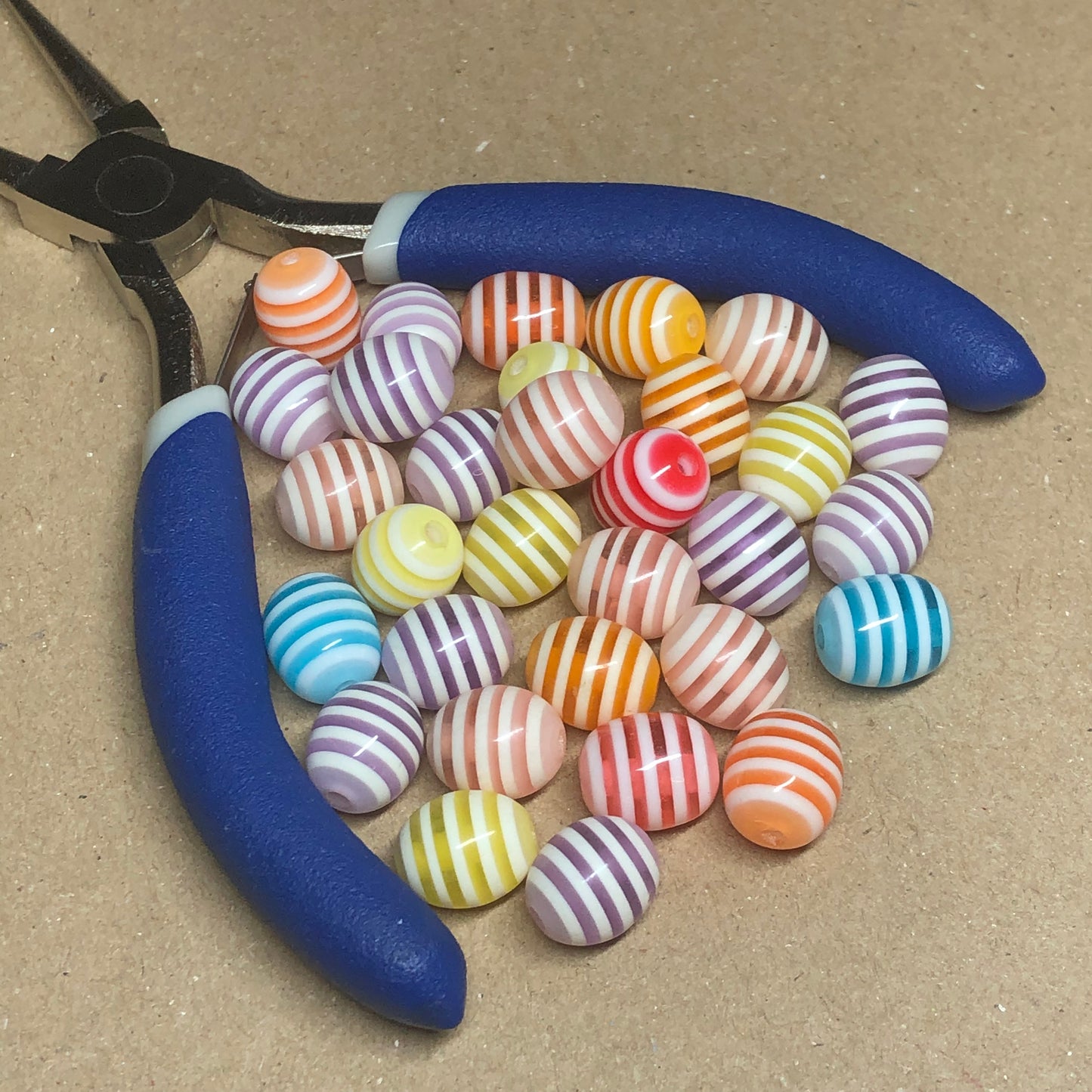 Striped oval acrylic beads