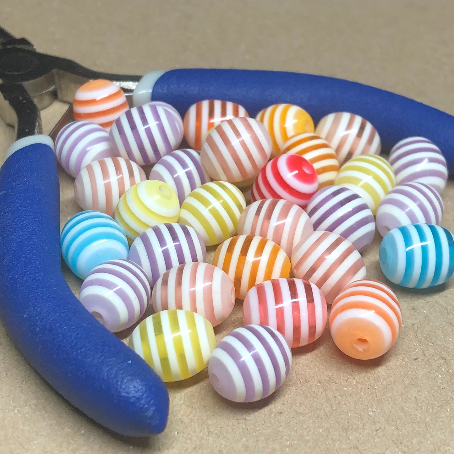 Striped oval acrylic beads