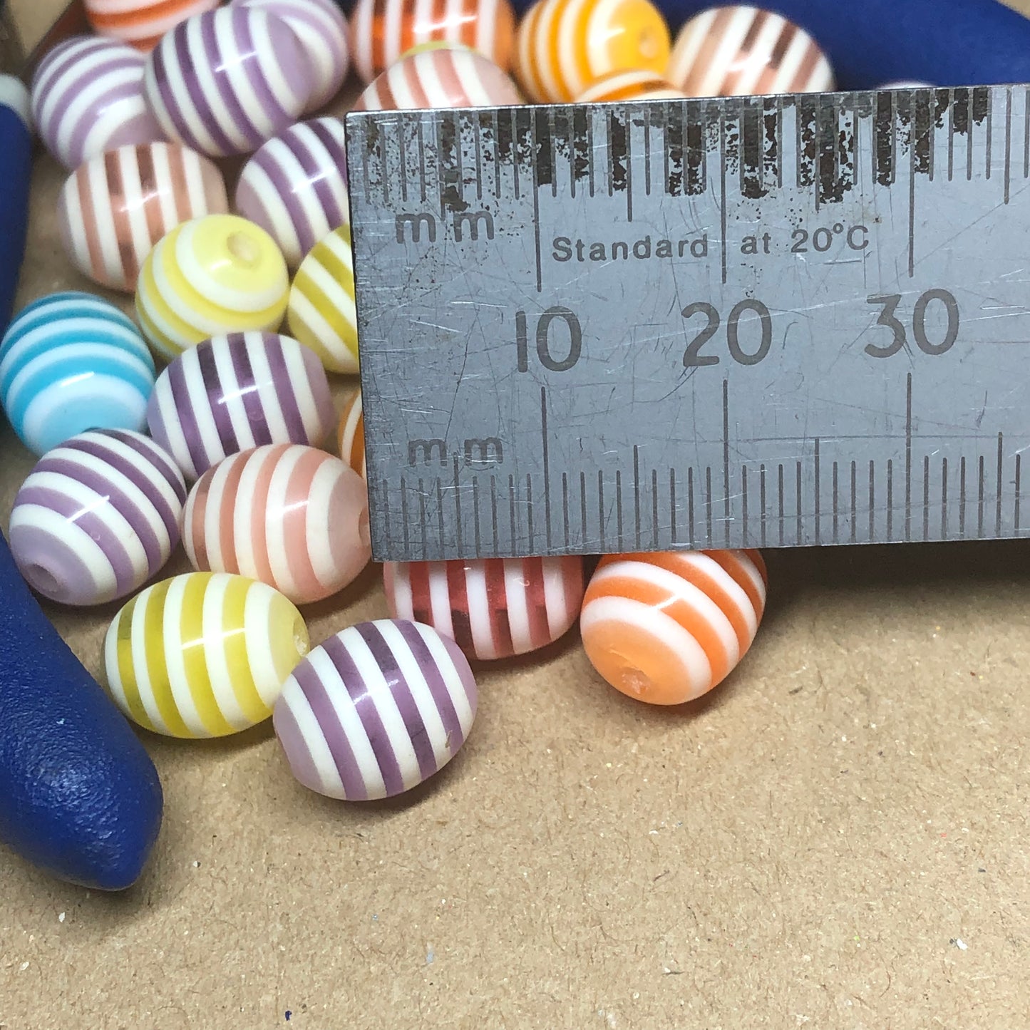 Striped oval acrylic beads