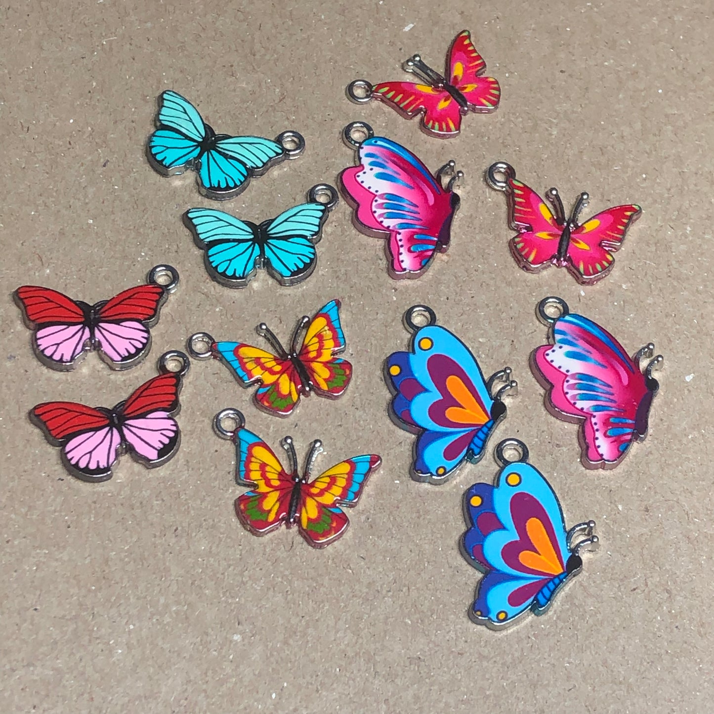 Twelve colourful butterfly charms