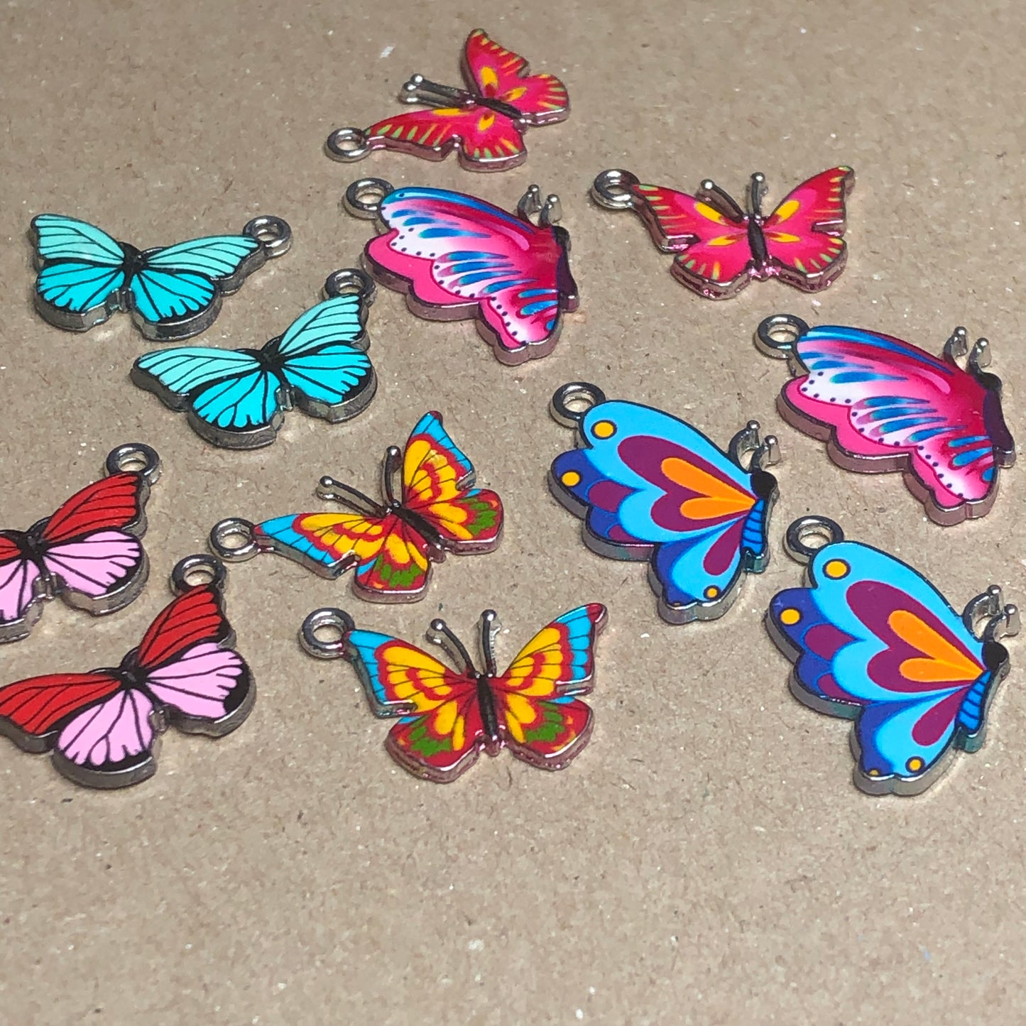 Twelve colourful butterfly charms