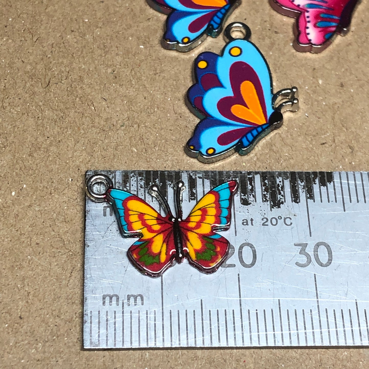 Twelve colourful butterfly charms