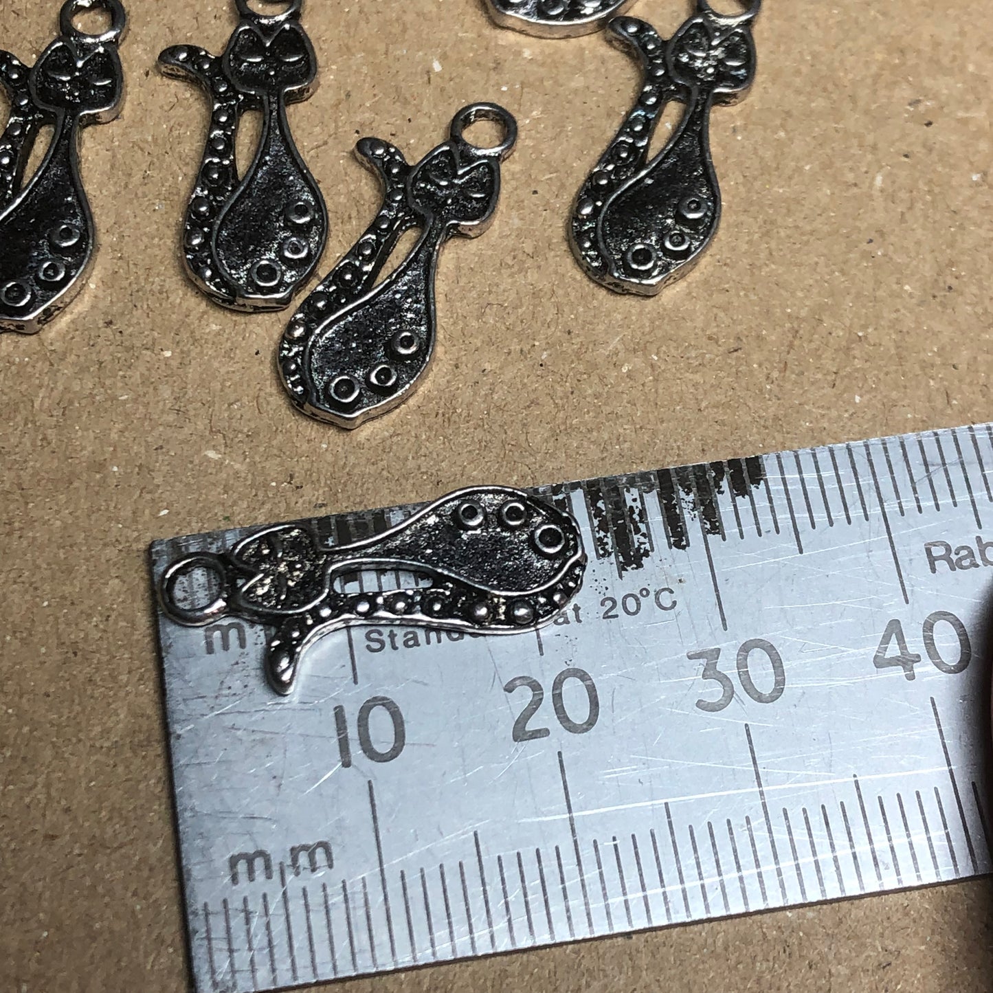 Twelve elegant cat charms