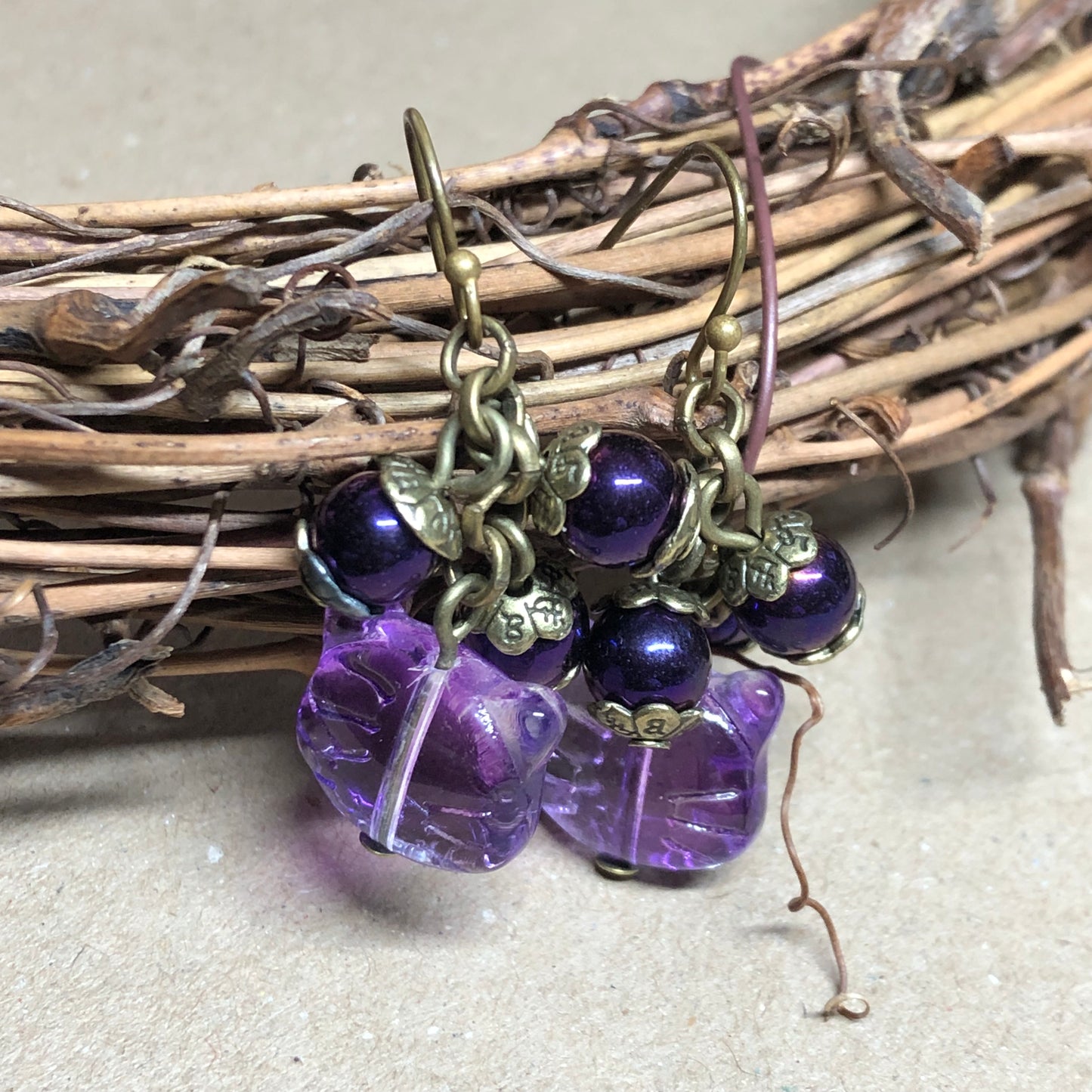 Purple glass cat cluster bronze earrings