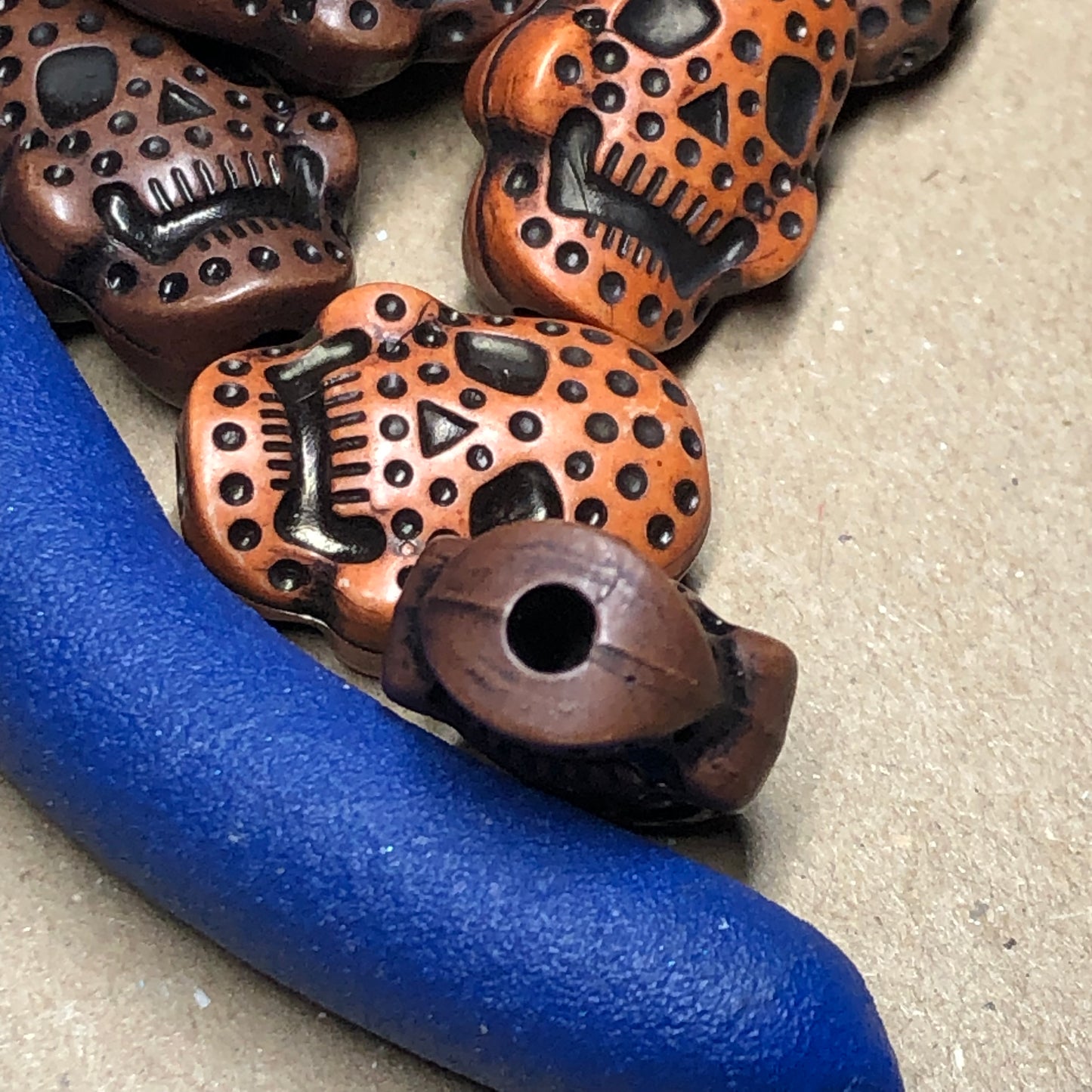 Orange and brown skull beads 8mm