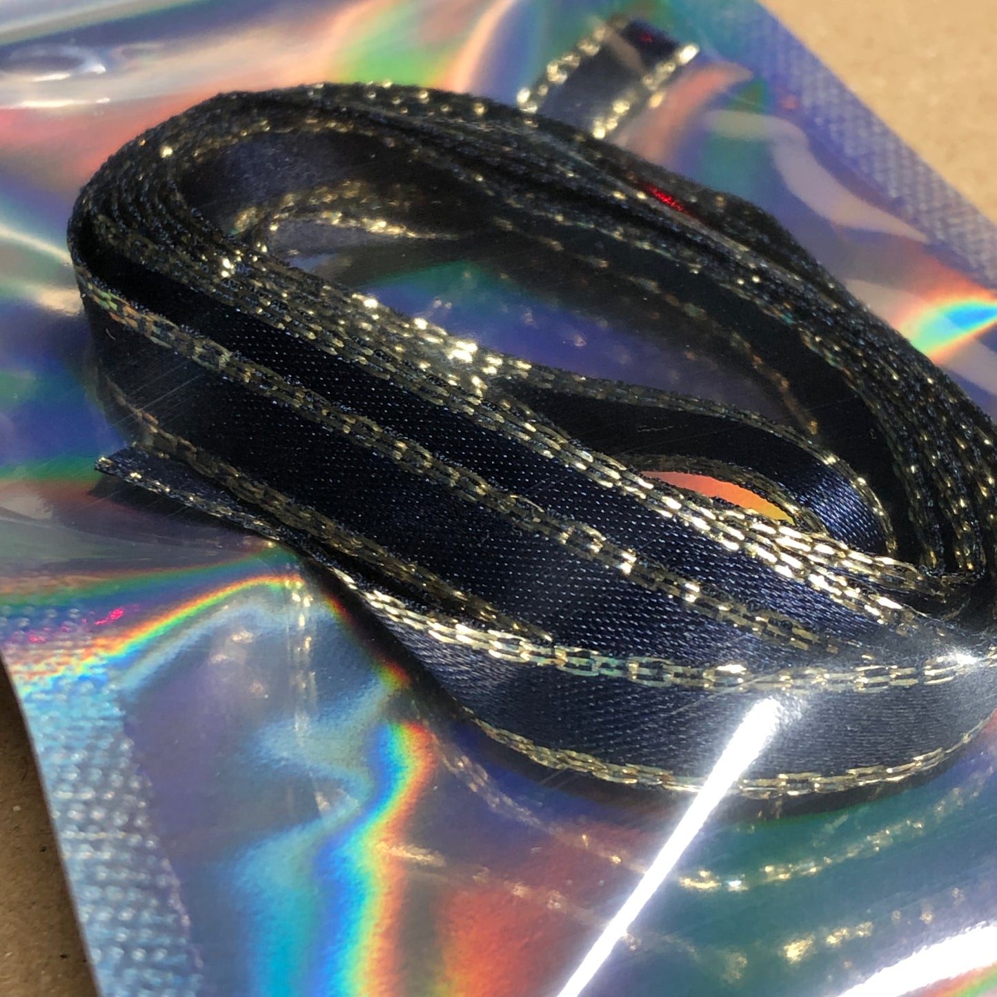 Gold edged navy blue satin ribbon 1.5m