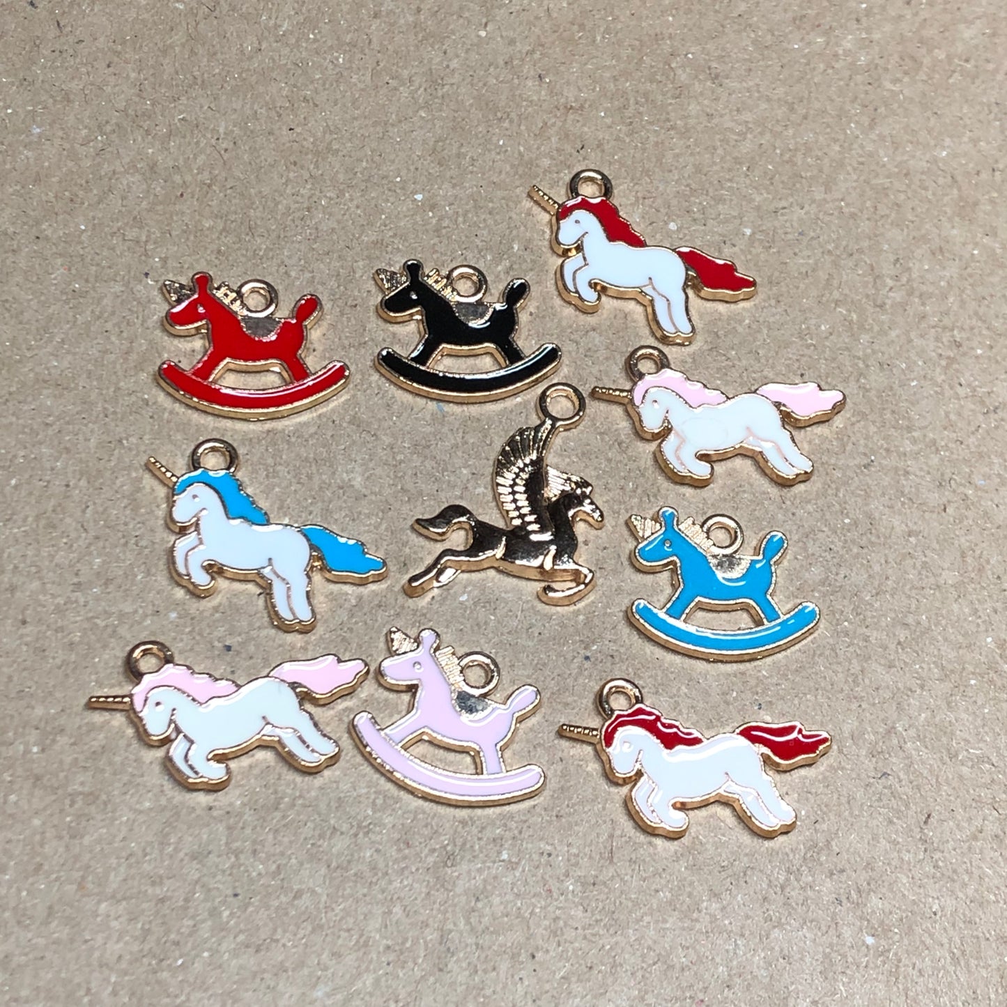 Ten gold and enamel horse unicorn charms