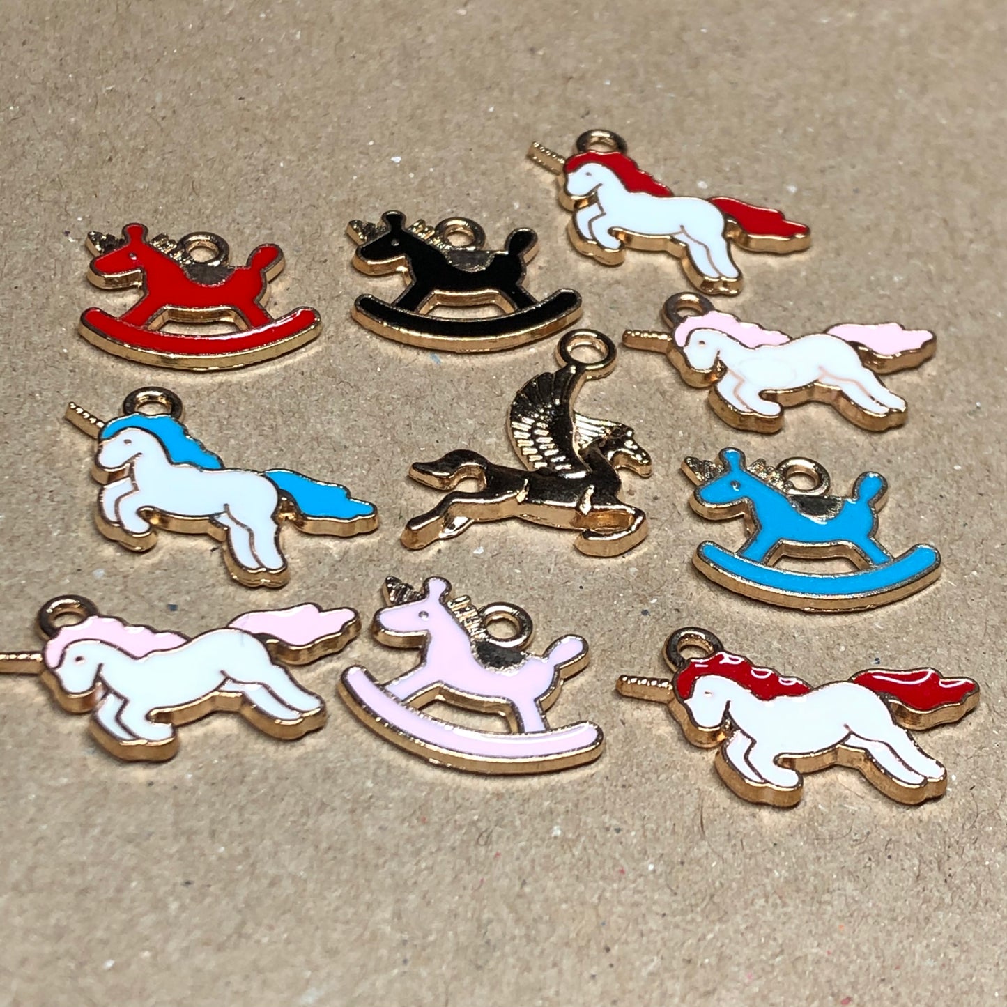 Ten gold and enamel horse unicorn charms