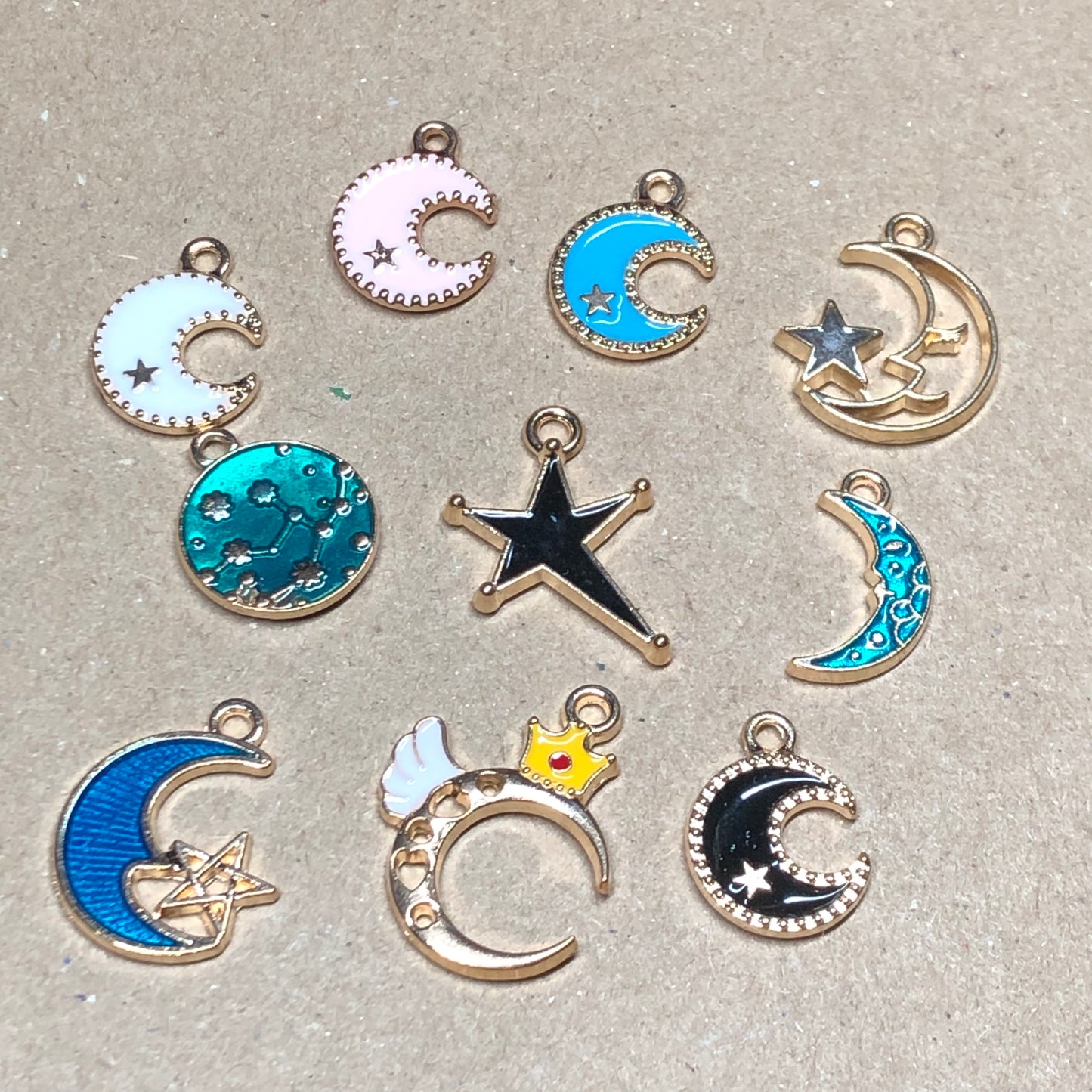 Ten gold and enamel night sky charms