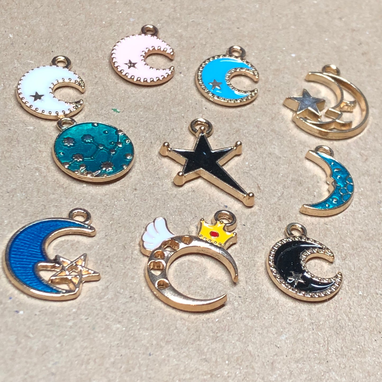 Ten gold and enamel night sky charms