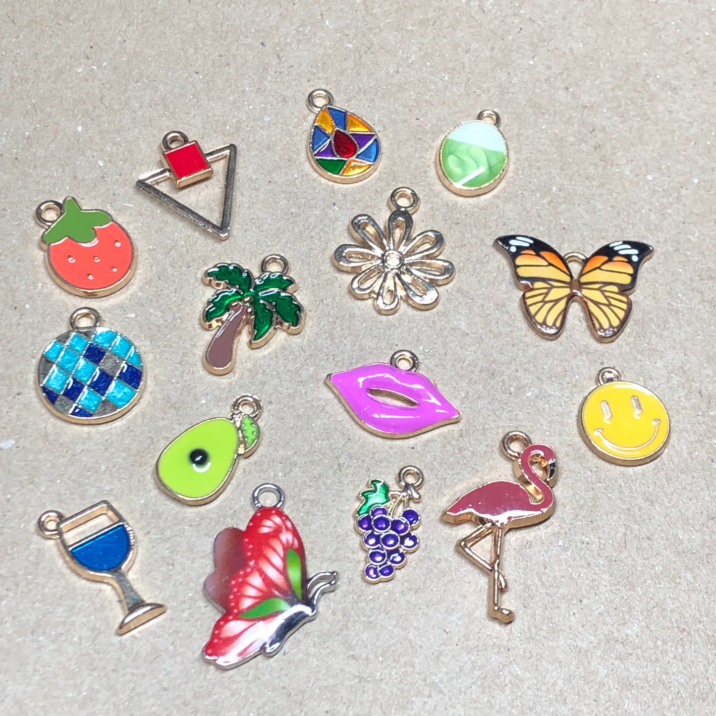 Fifteen gold and enamel Summer charms