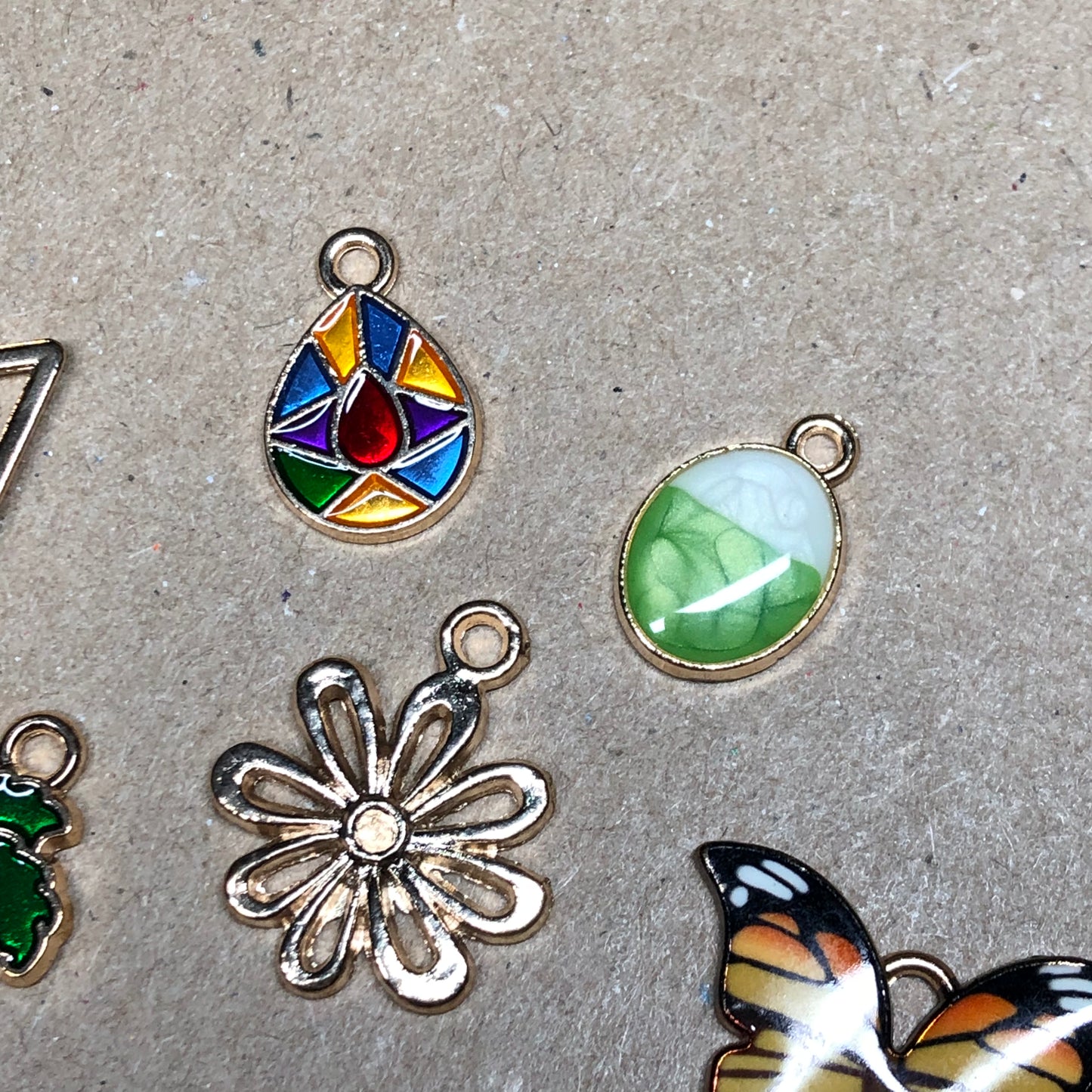 Fifteen gold and enamel Summer charms