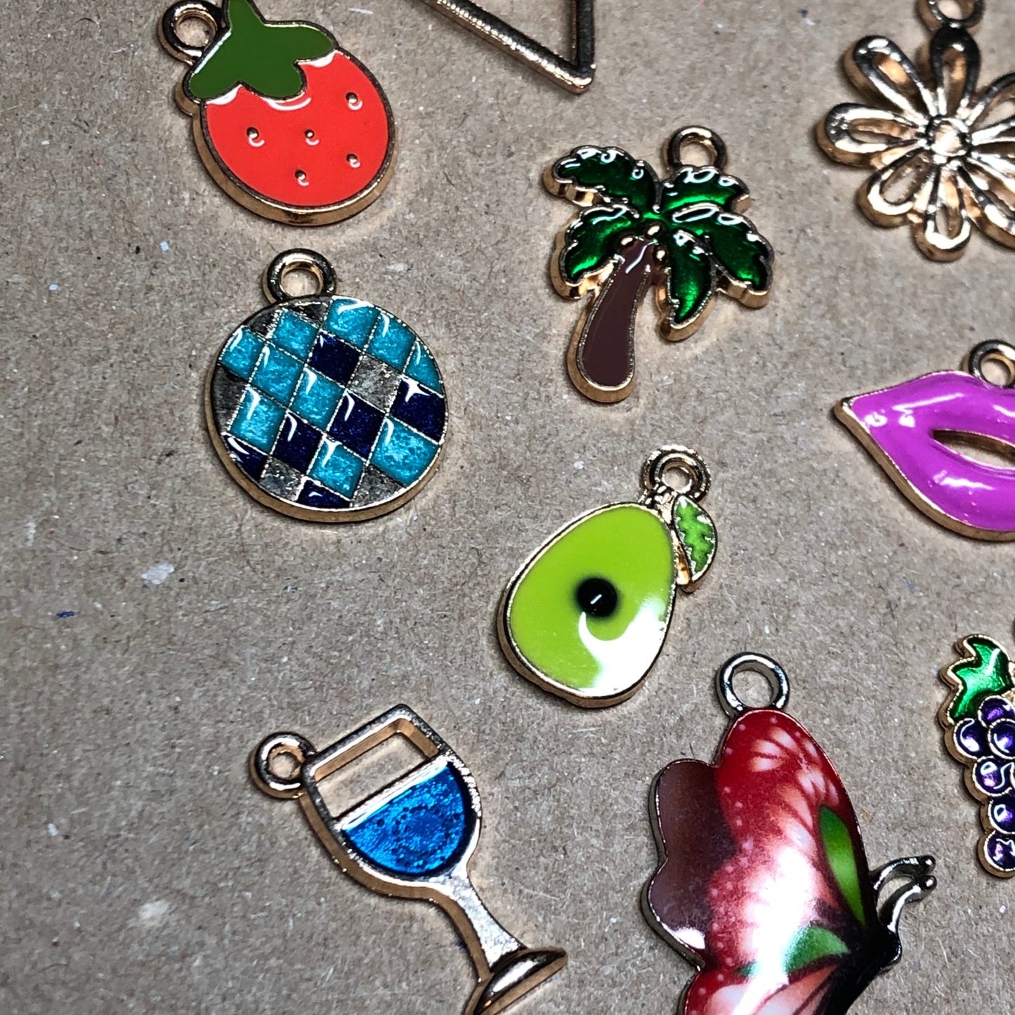 Fifteen gold and enamel Summer charms