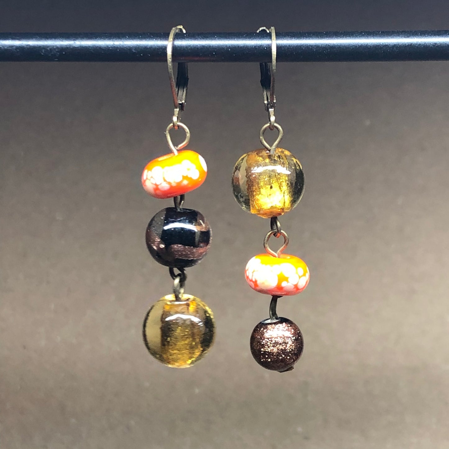 Mismatched orange glass bead earrings